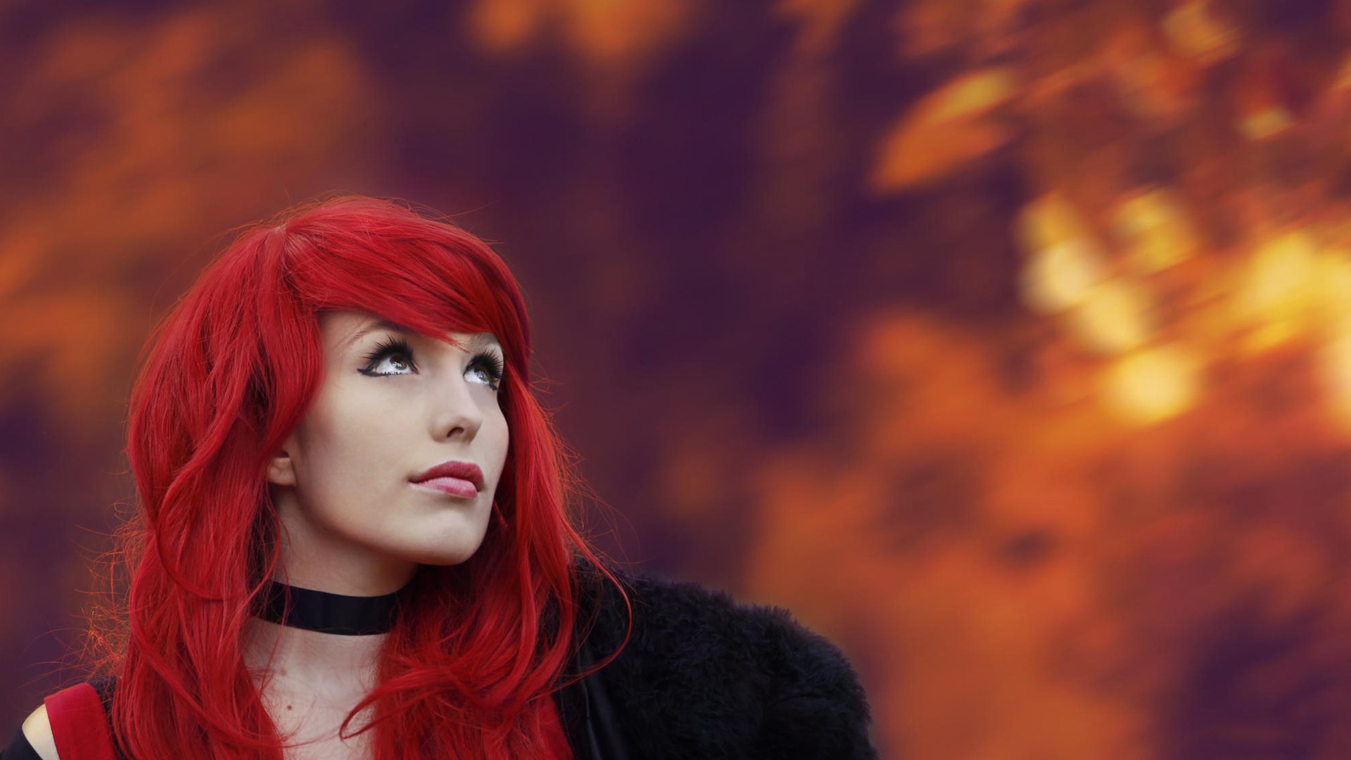 Woman with bright red hair looking up HD Wallpaper