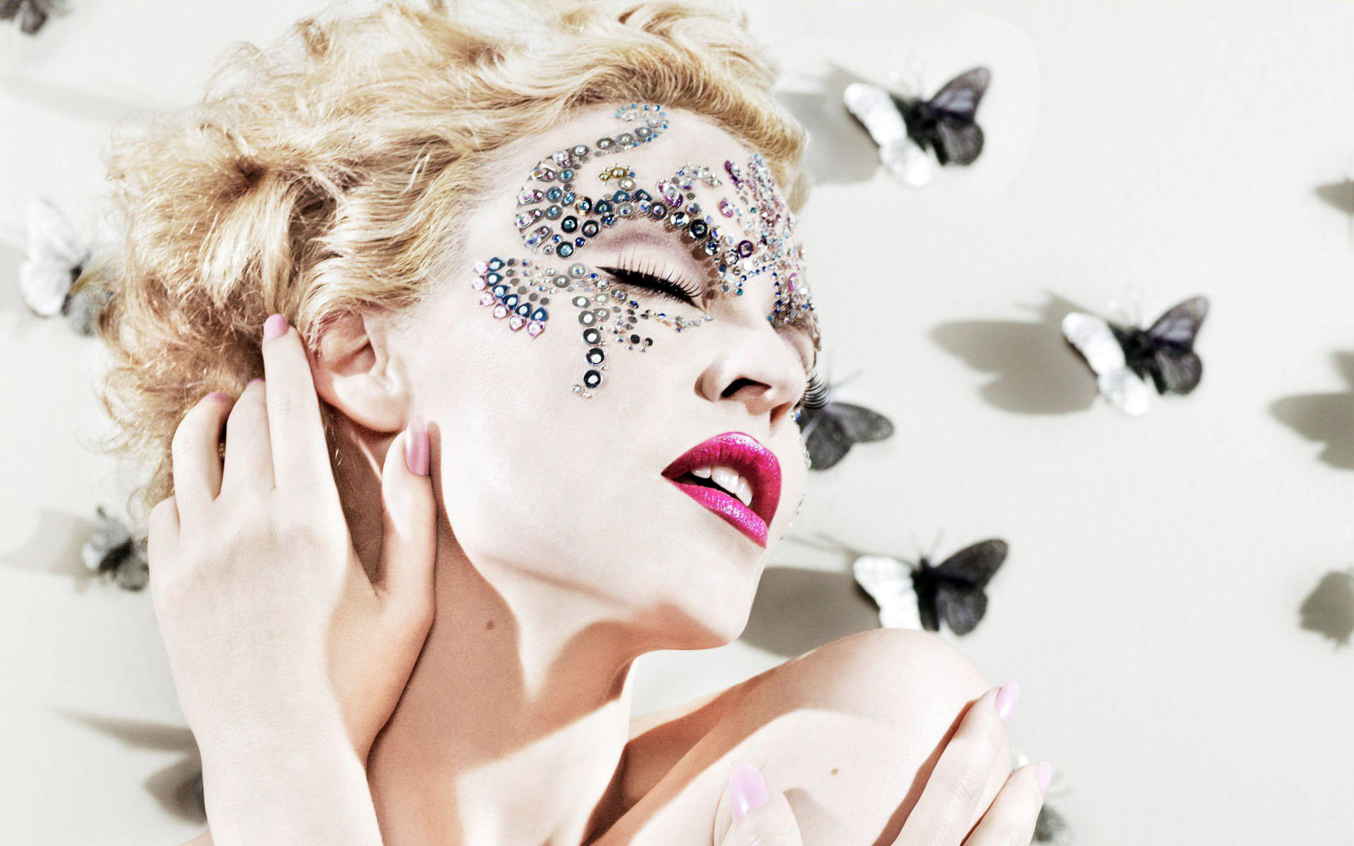 Kylie Minogue with face gems and butterflies HD Wallpaper