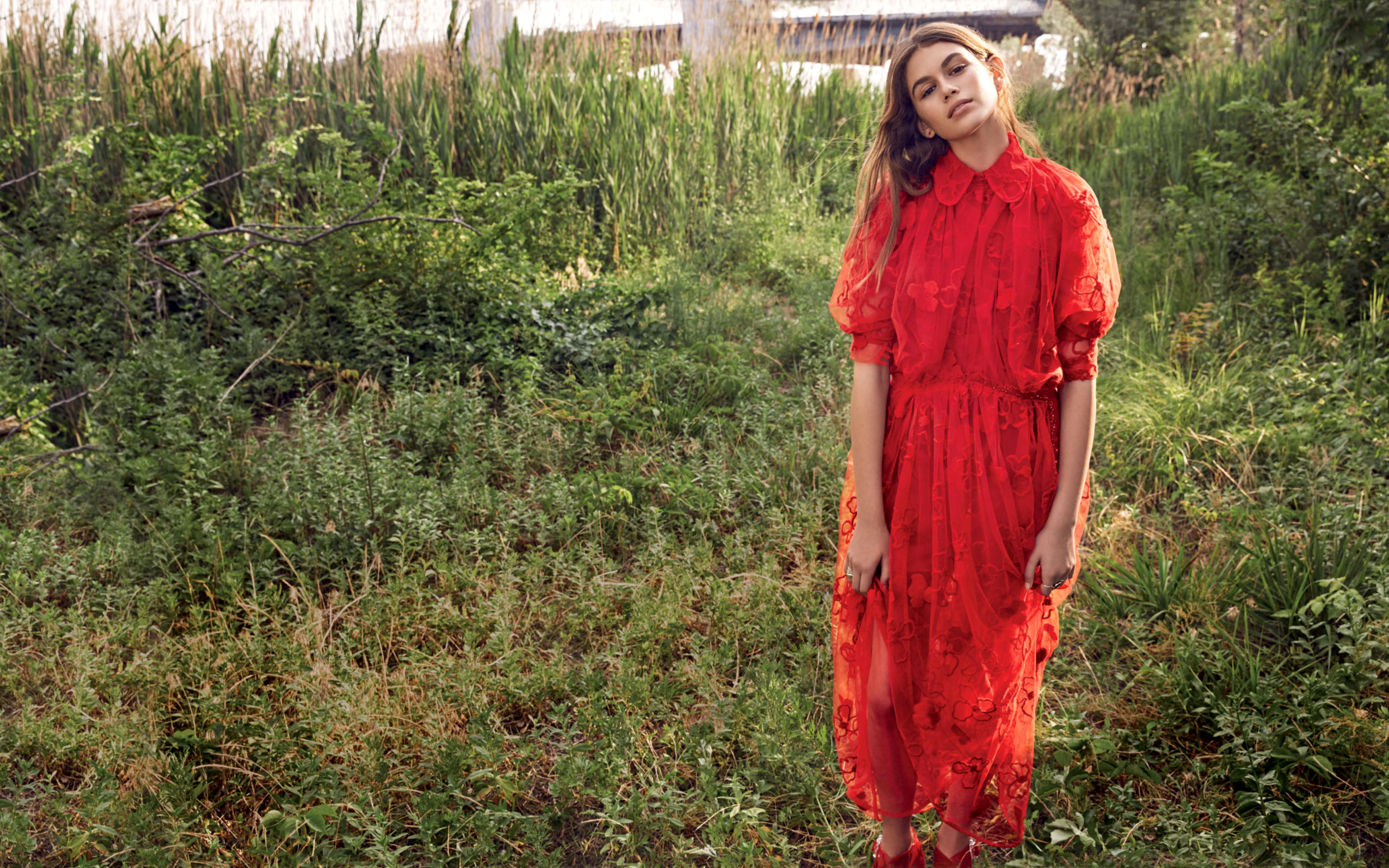 Kaia Gerber in red dress outdoors HD Wallpaper