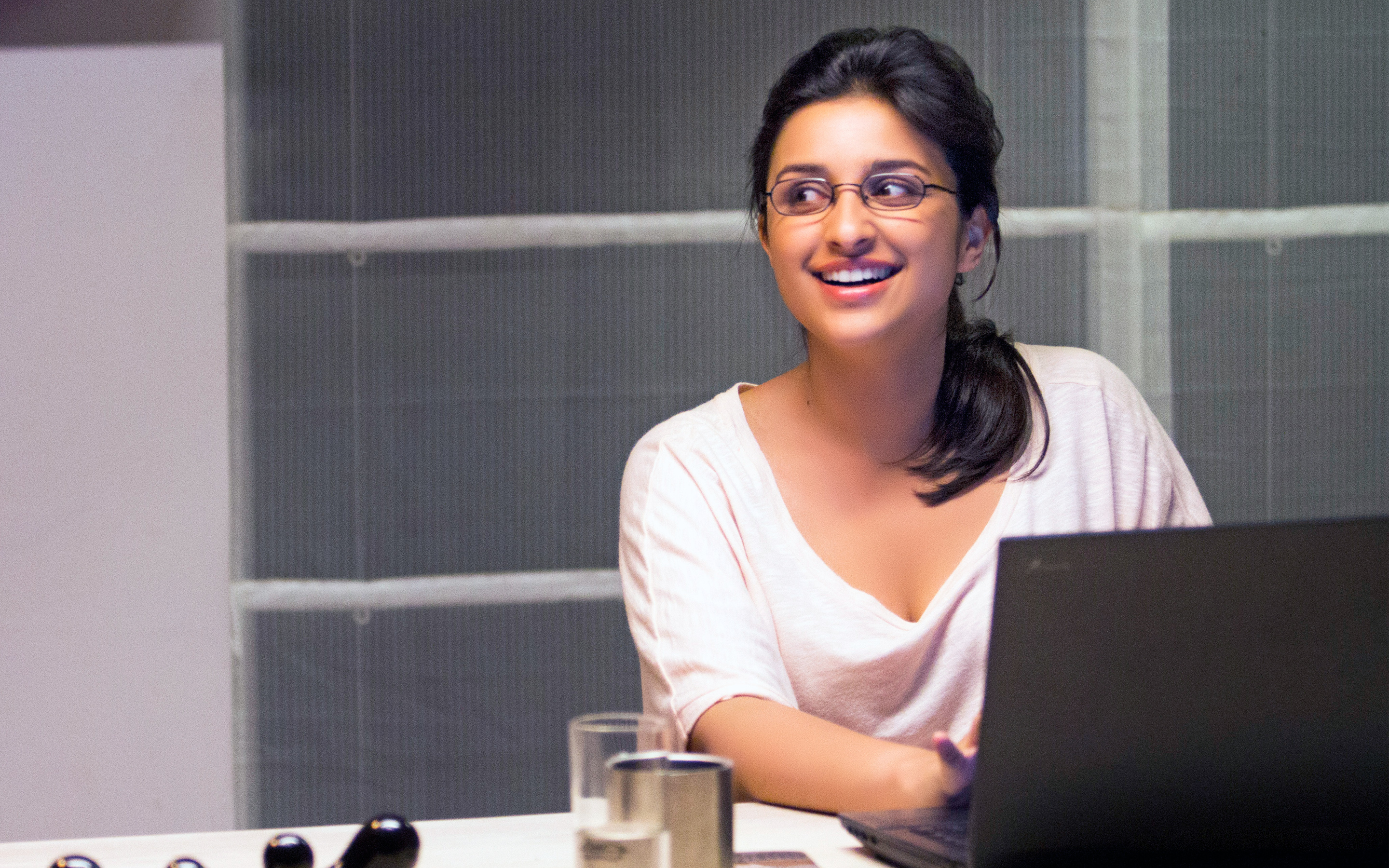 Parineeti Chopra working on a laptop HD Wallpaper