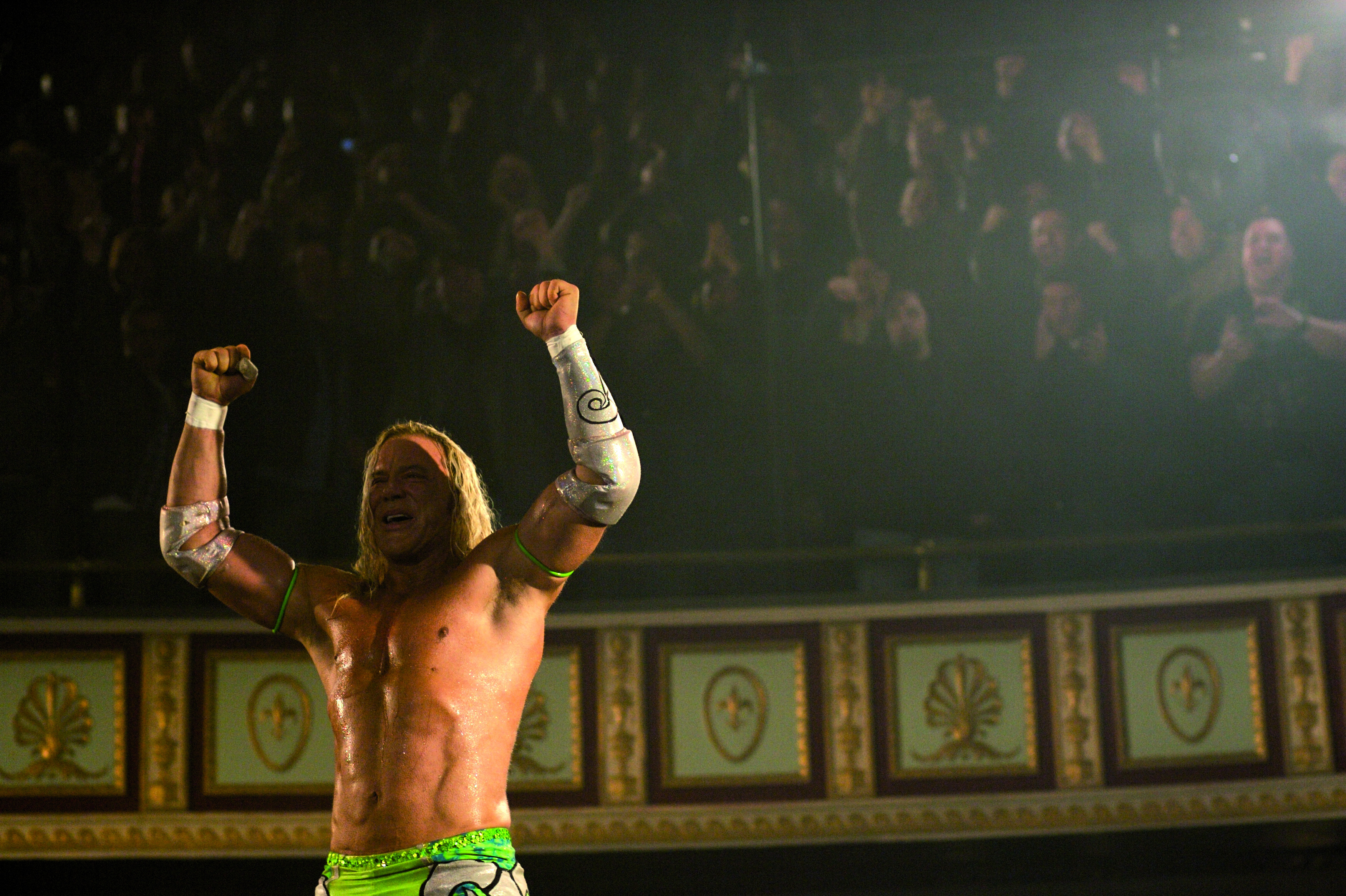 Mickey Rourke celebrating in a wrestling ring HD Wallpaper
