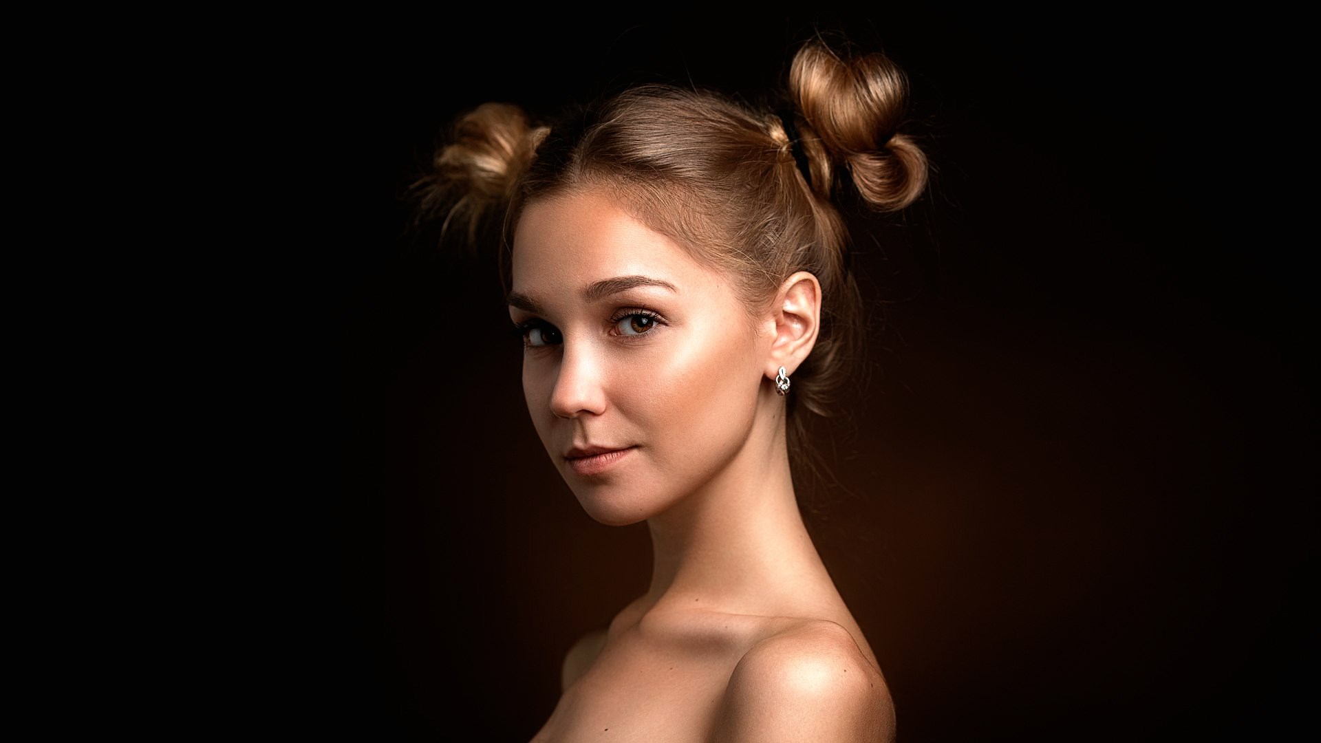 Young woman with hair in buns HD Wallpaper