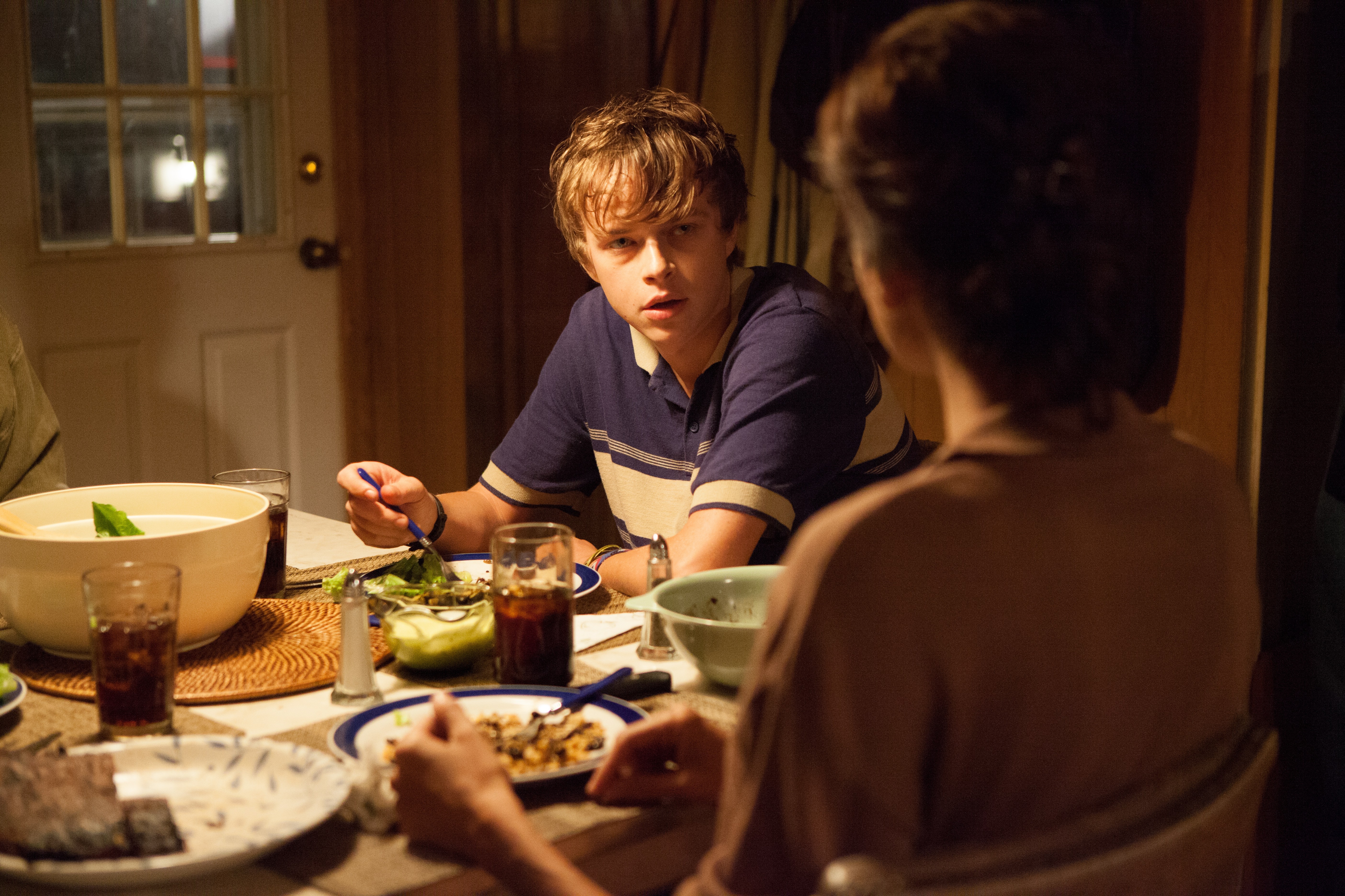 Dane DeHaan at a dinner table HD Wallpaper