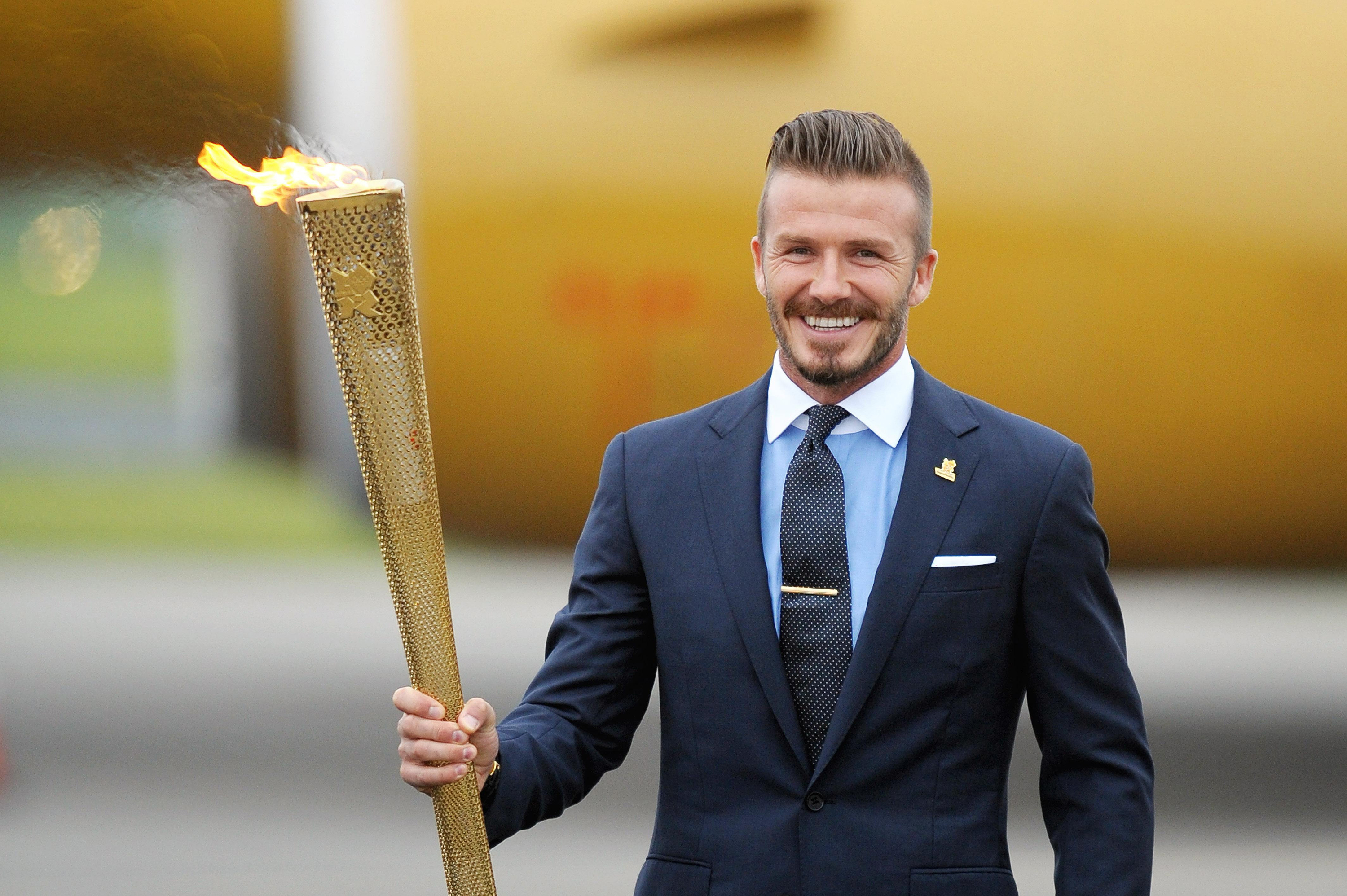 David Beckham holding Olympic torch HD Wallpaper