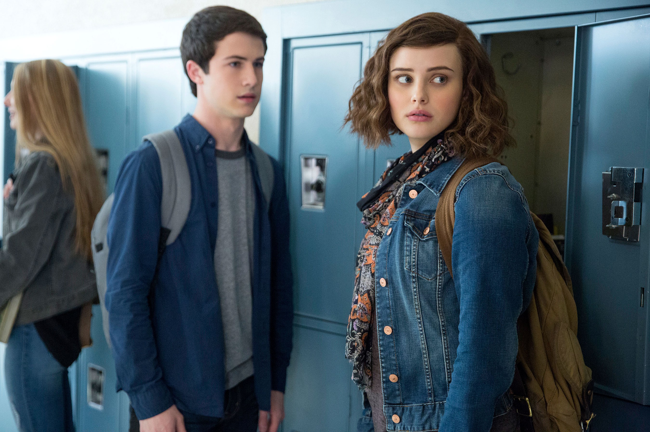 Katherine Langford and Dylan Minnette in hallway HD Wallpaper