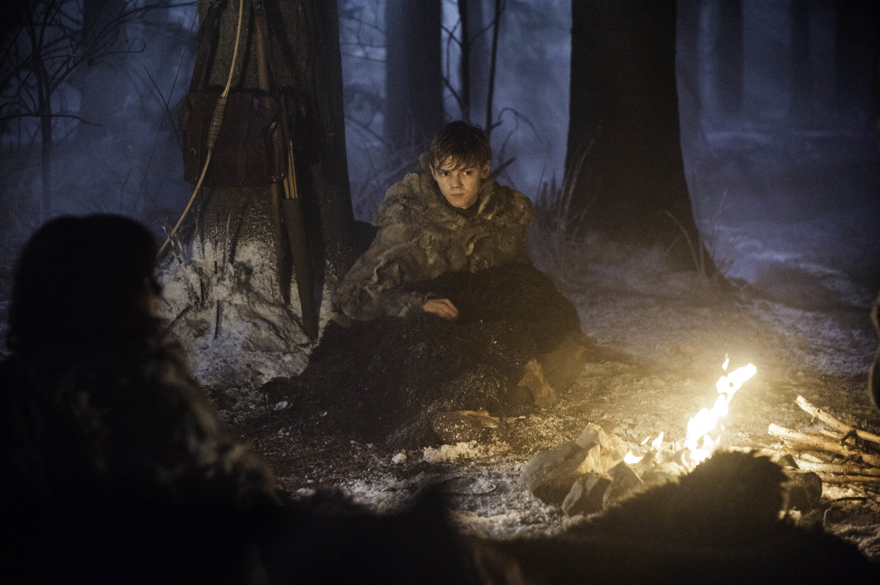 Thomas Brodie-Sangster in a snowy forest HD Wallpaper