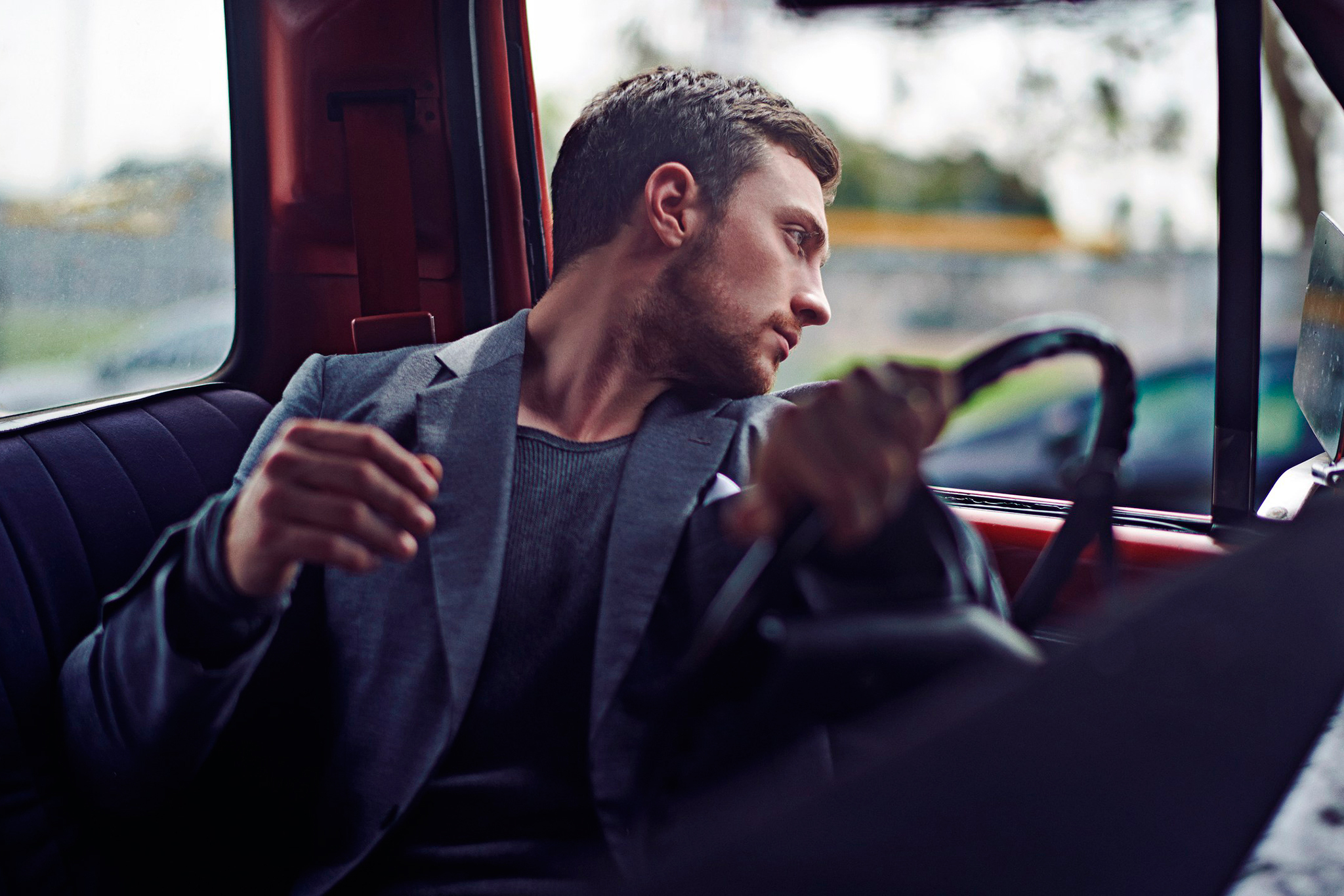 Aaron Taylor-Johnson in a car HD Wallpaper