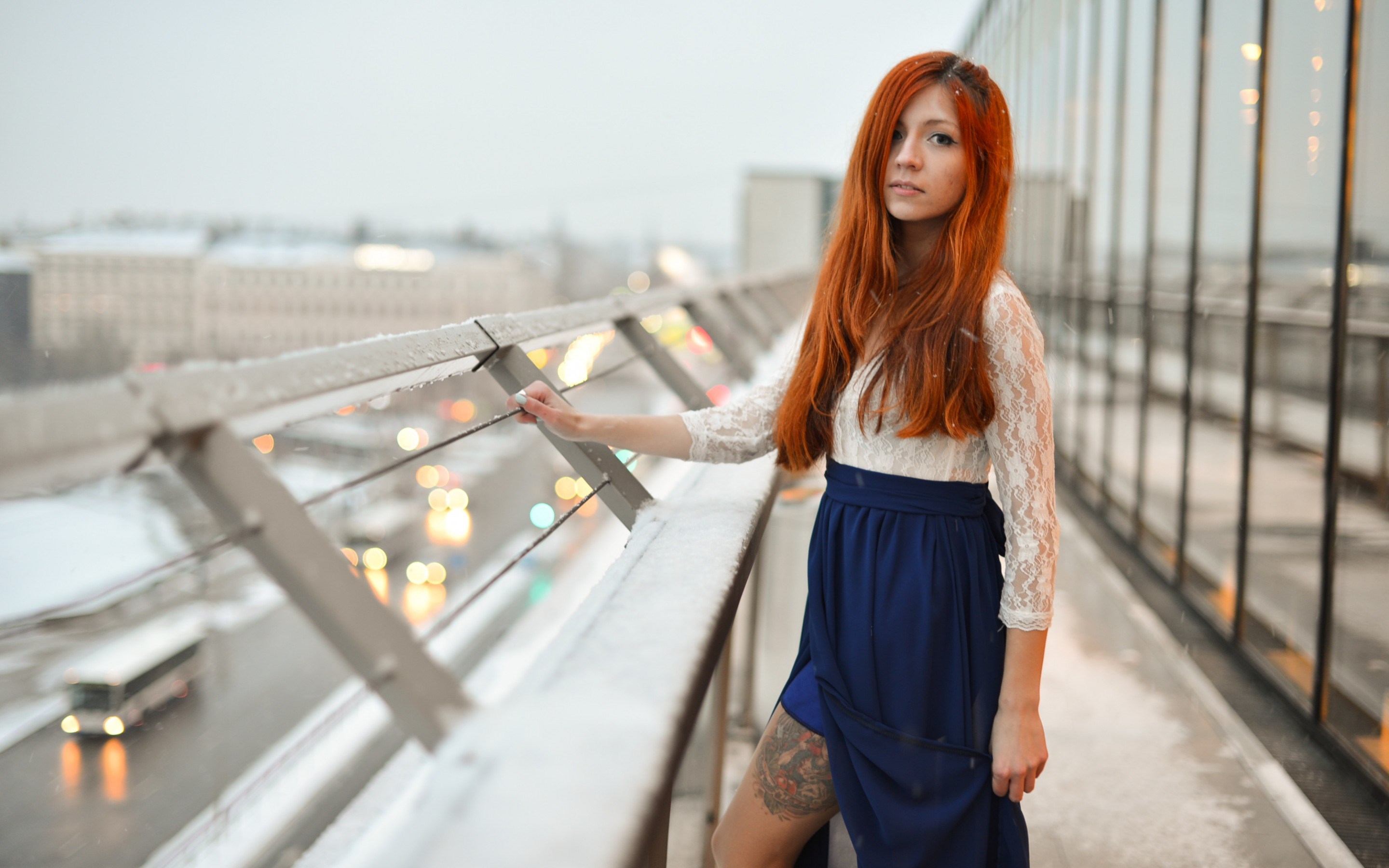 Woman with red hair on a snowy balcony HD Wallpaper