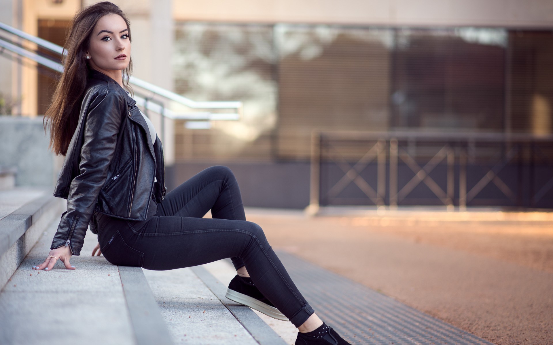 Woman in leather jacket sitting on stairs HD Wallpaper