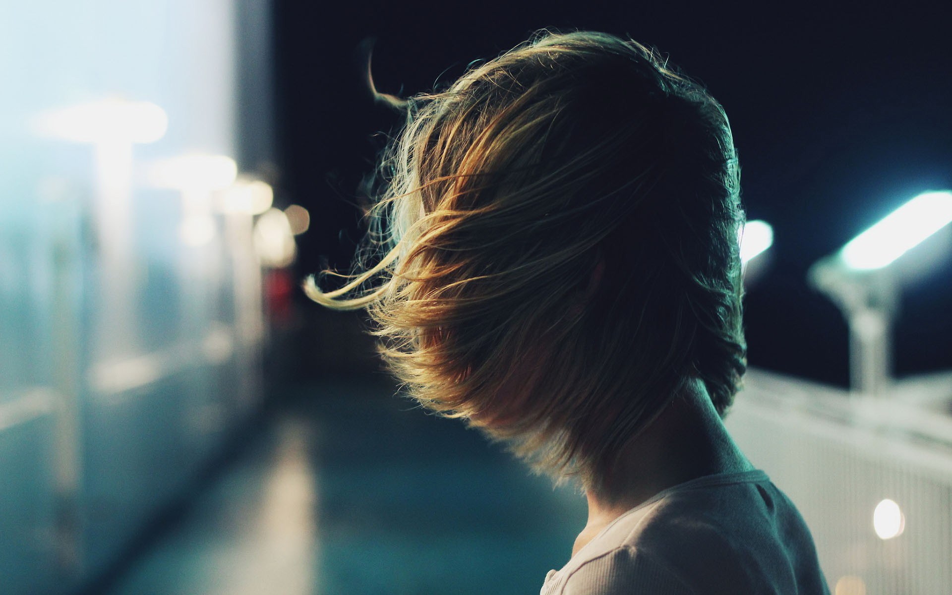 Woman with windblown hair at night HD Wallpaper