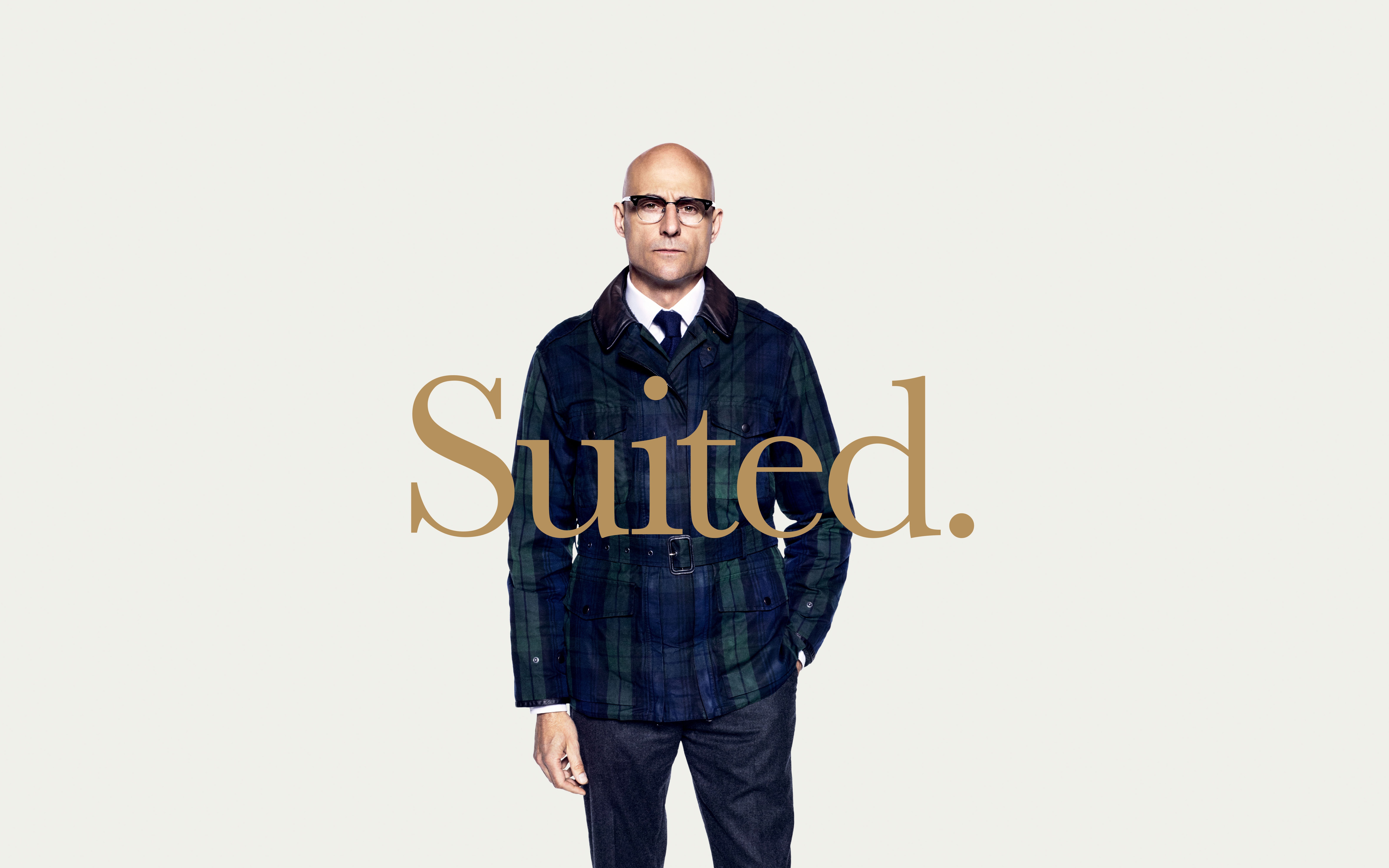 Mark Strong in a plaid jacket with text Suited. HD Wallpaper