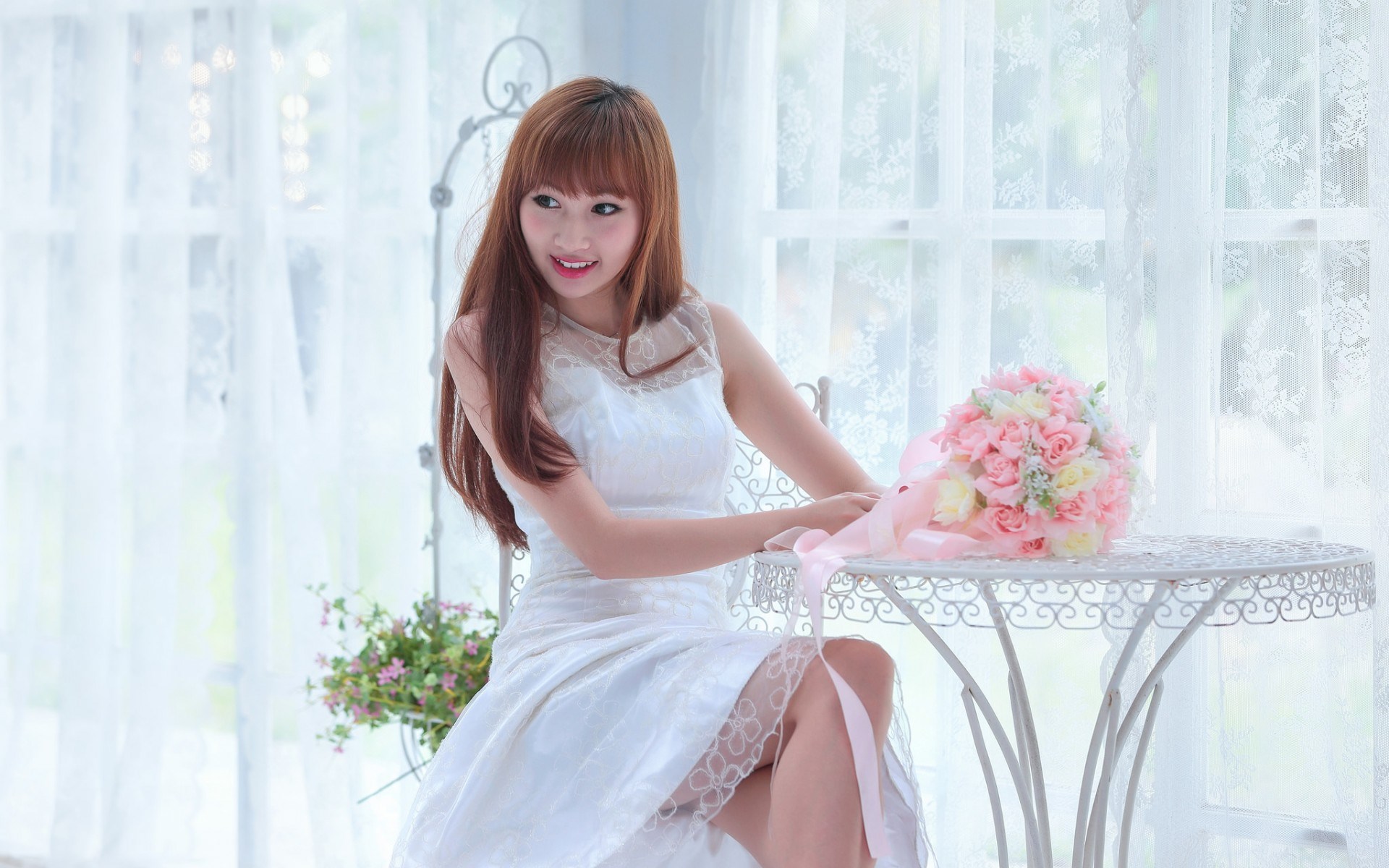 Woman in white dress with pink and yellow bouquet HD Wallpaper