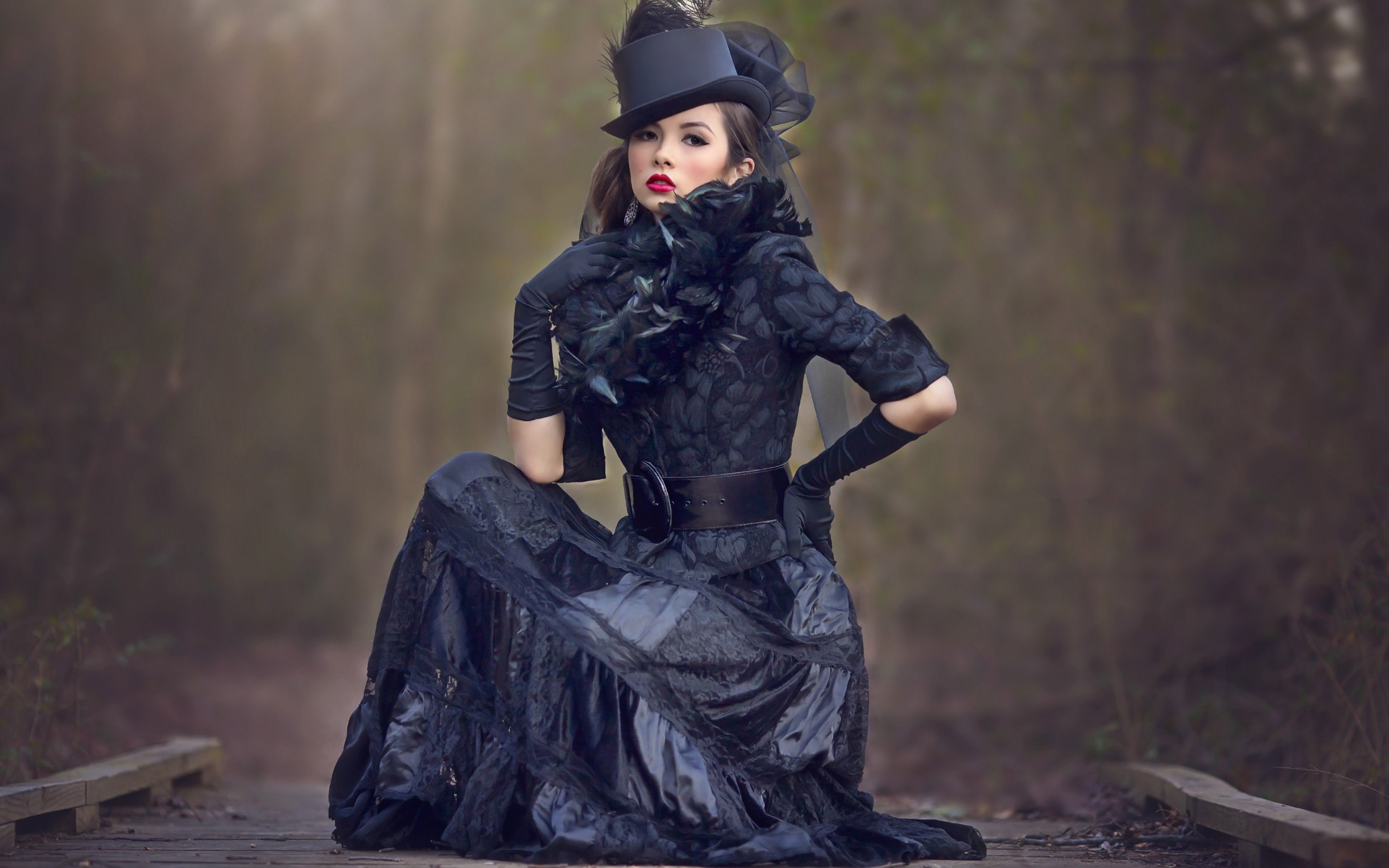 Woman in Victorian-style black dress and top hat HD Wallpaper
