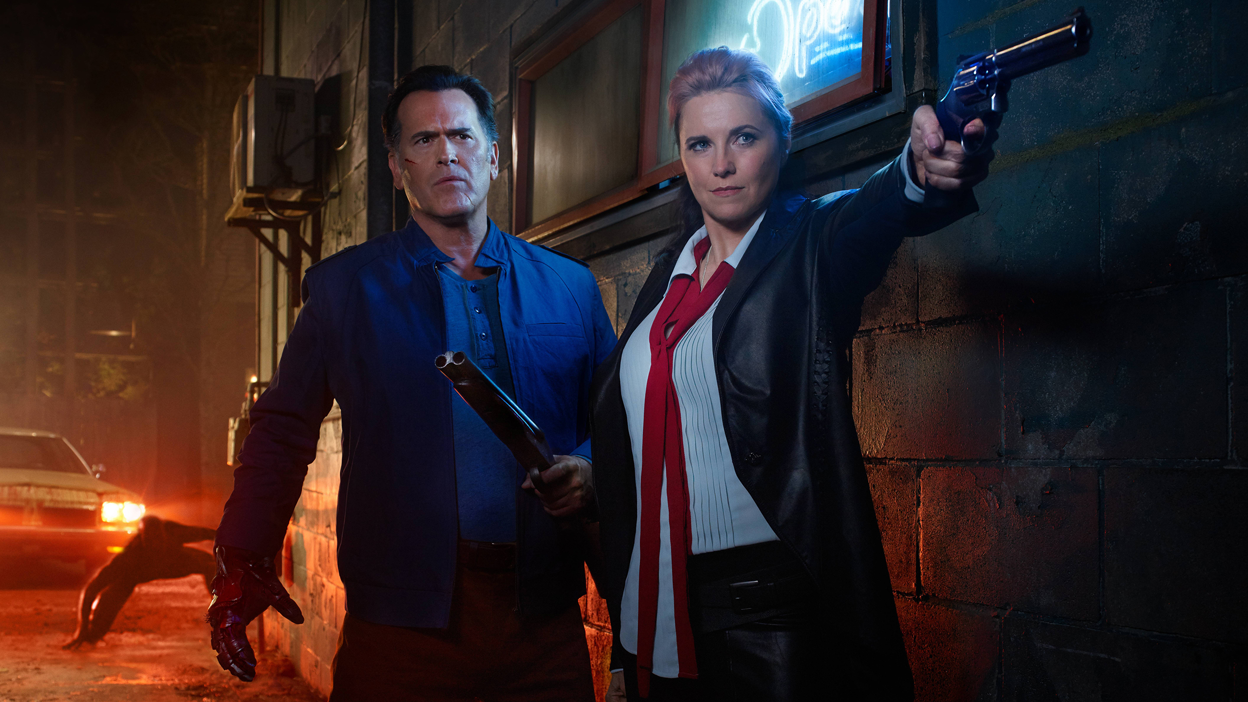Lucy Lawless and Bruce Campbell with guns HD Wallpaper