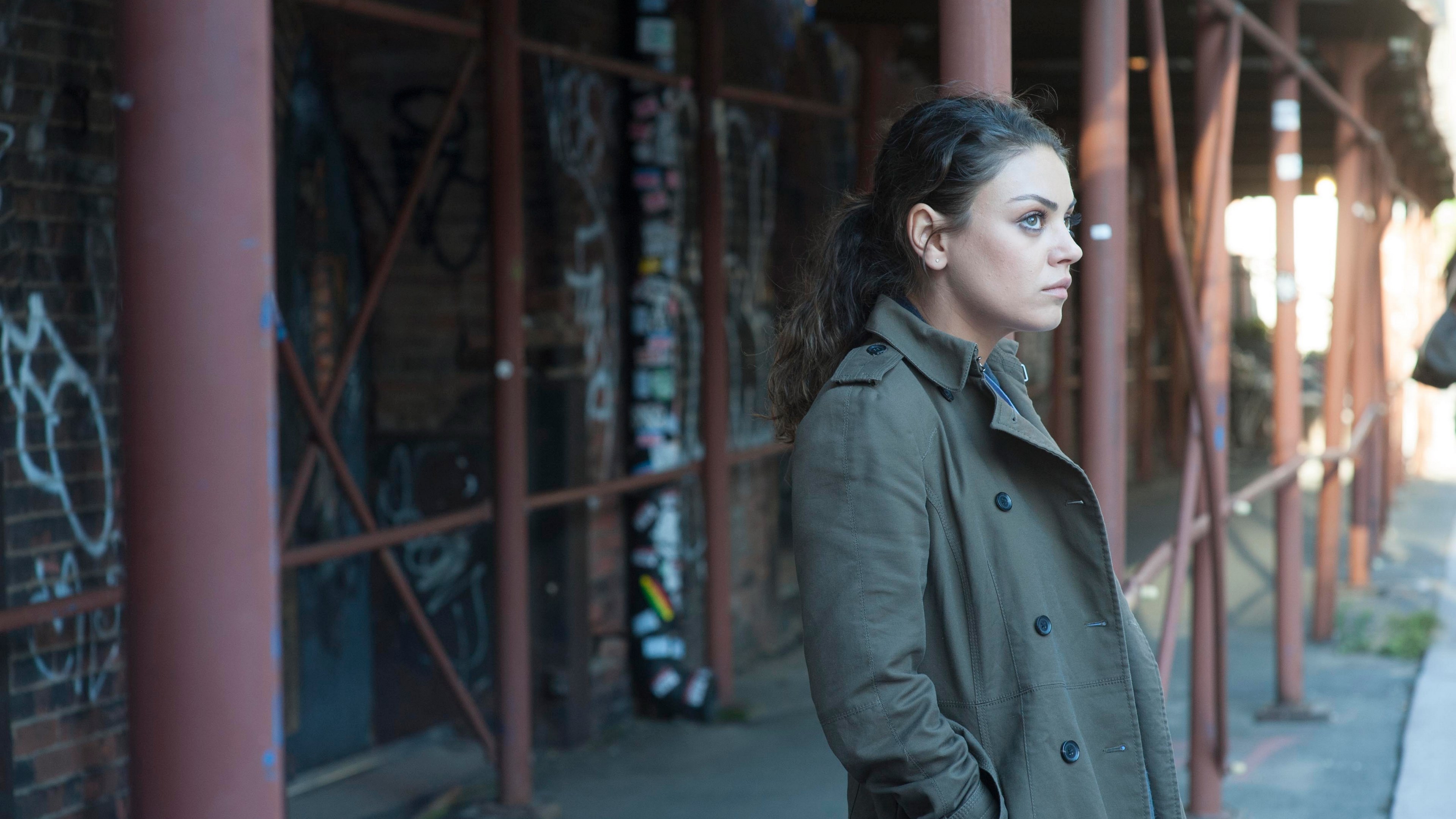 Woman in trench coat standing near graffiti HD Wallpaper