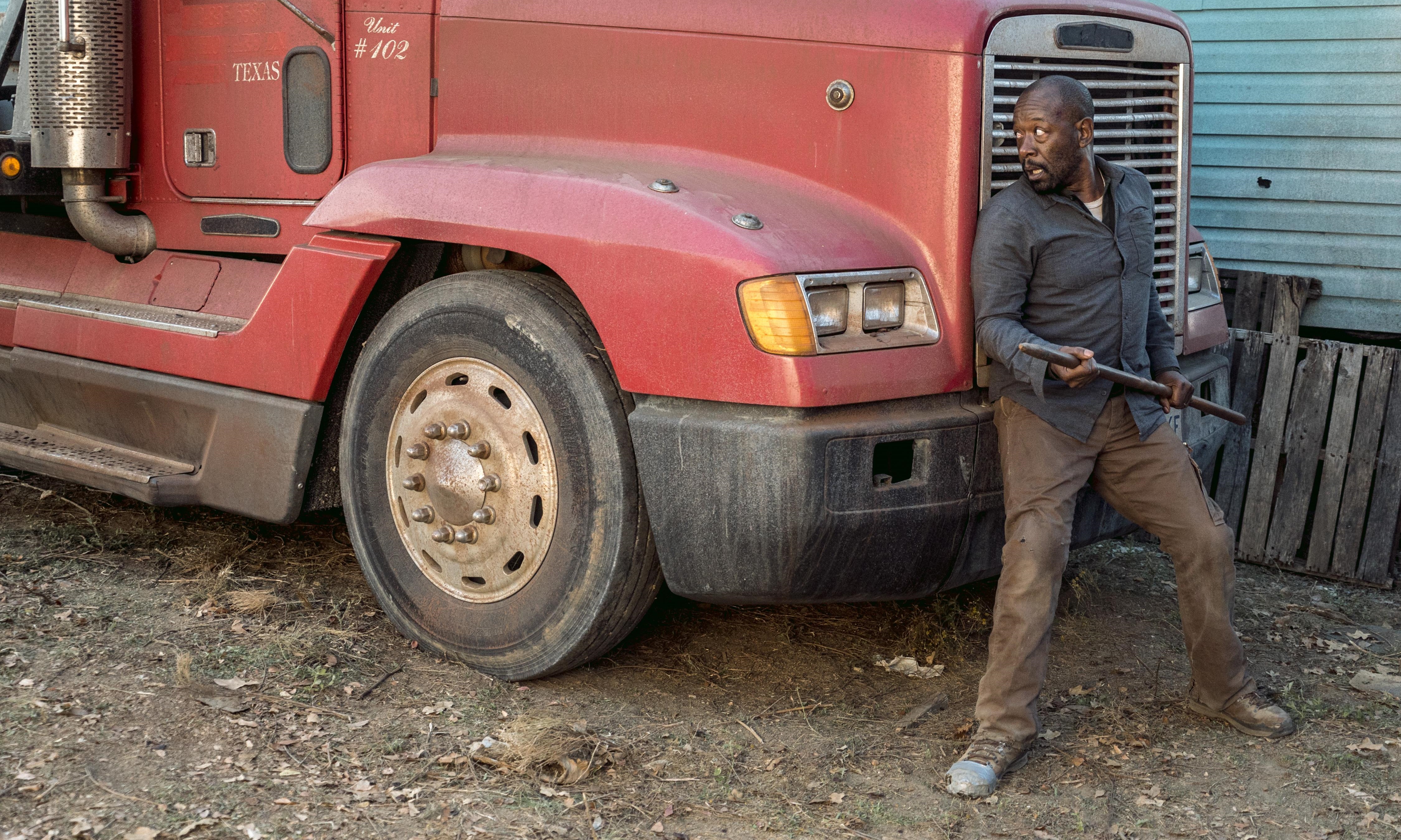 Lennie James in front of a red truck HD Wallpaper