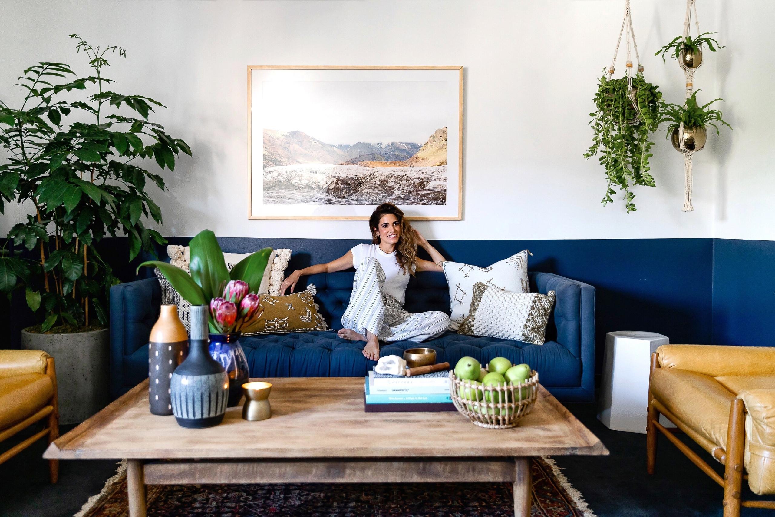 Nikki Reed on a blue sofa with plants HD Wallpaper