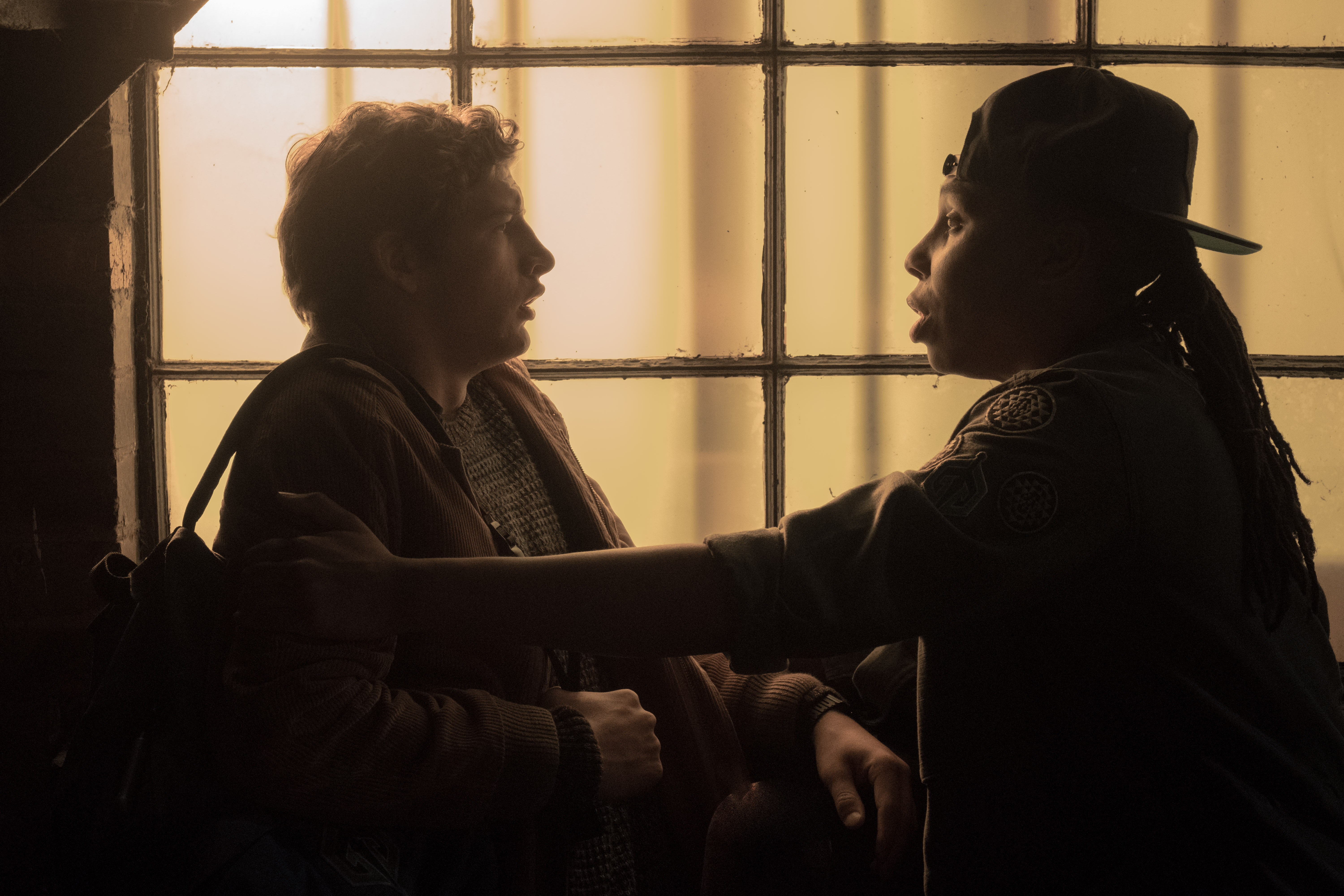 Tye Sheridan and another person by a window HD Wallpaper