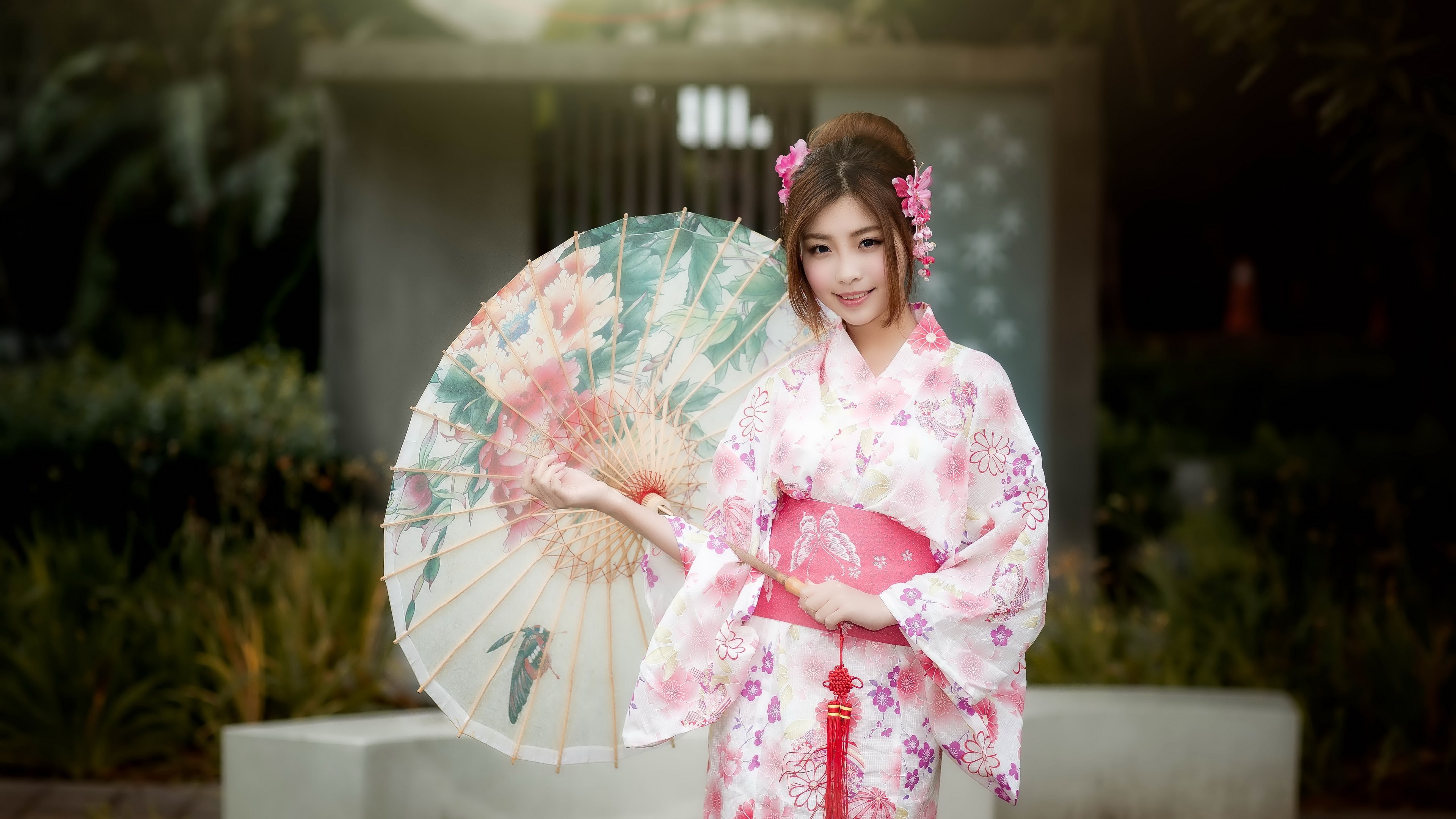 Woman in a pink kimono holding a floral umbrella HD Wallpaper