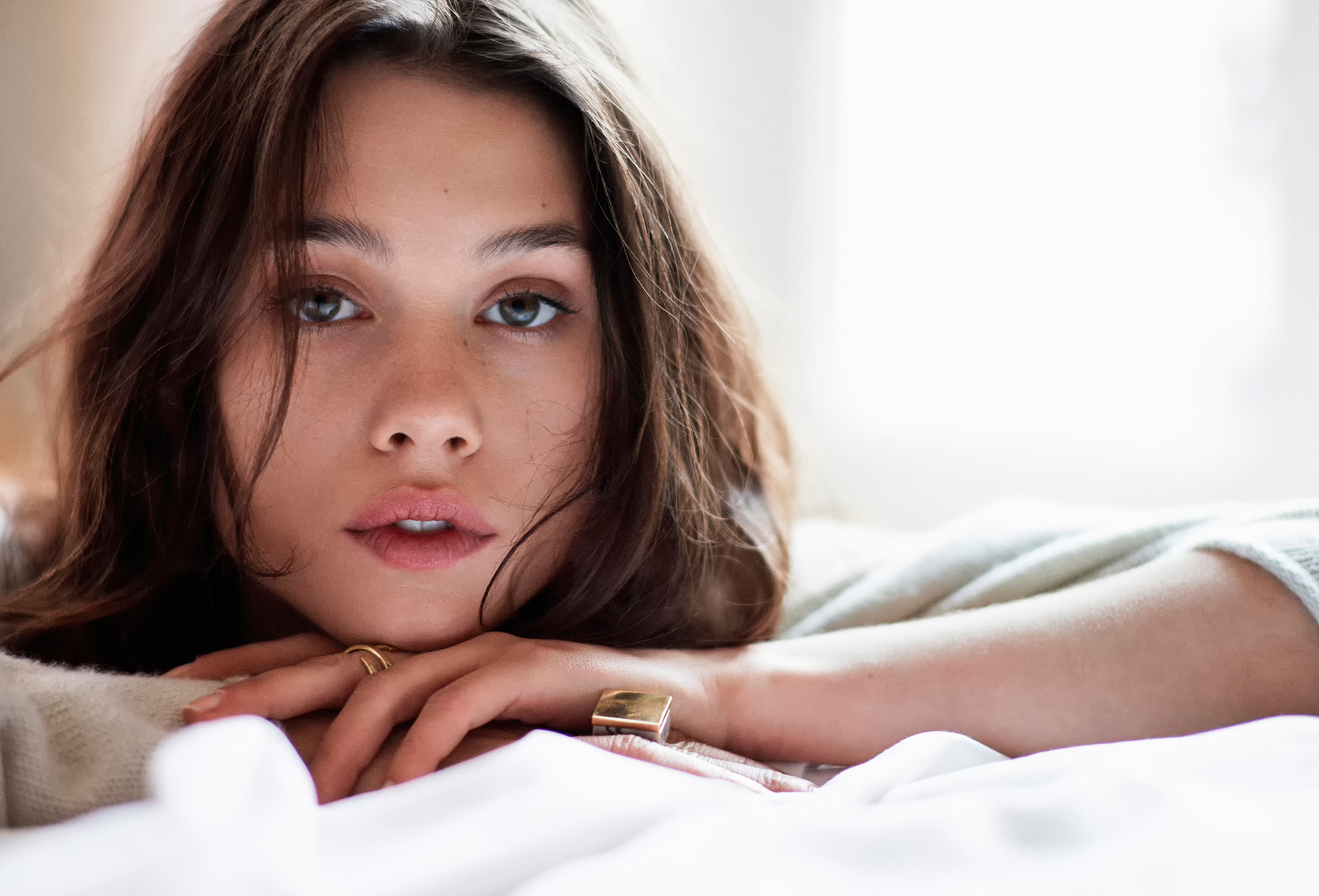 Astrid Bergès-Frisbey lying on a bed HD Wallpaper
