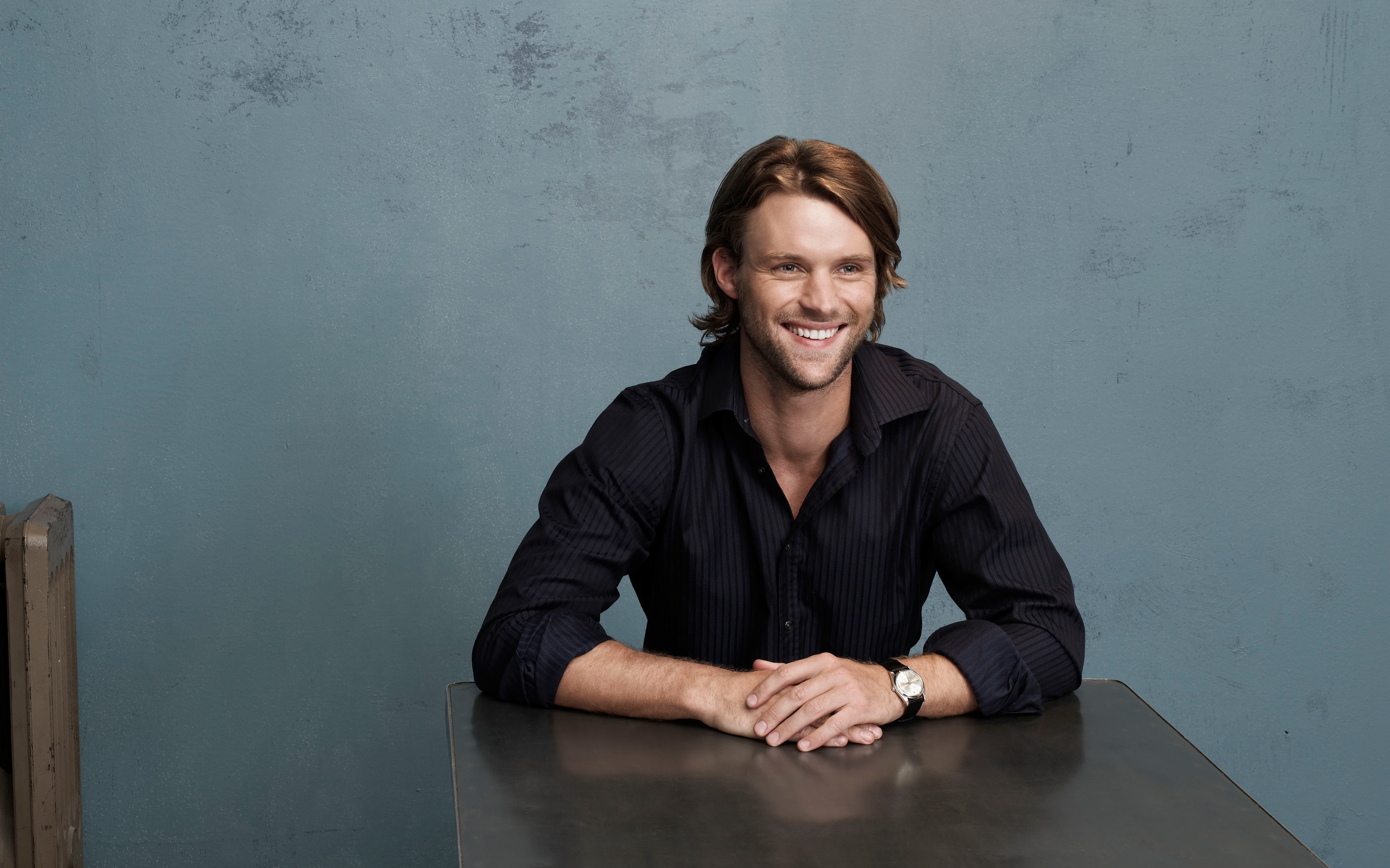 Jesse Spencer sitting at a table HD Wallpaper