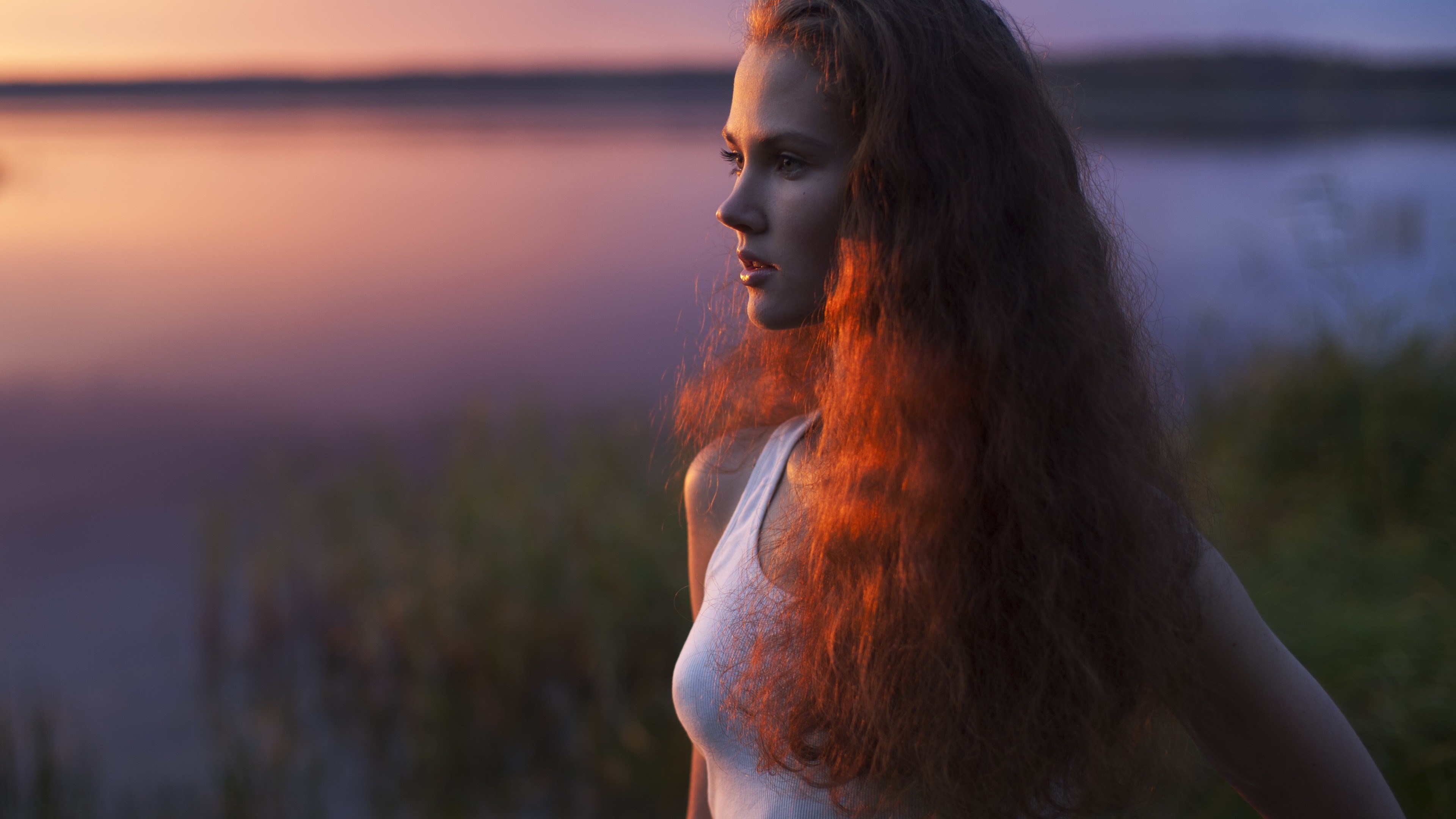 Woman with long curly hair at sunset HD Wallpaper