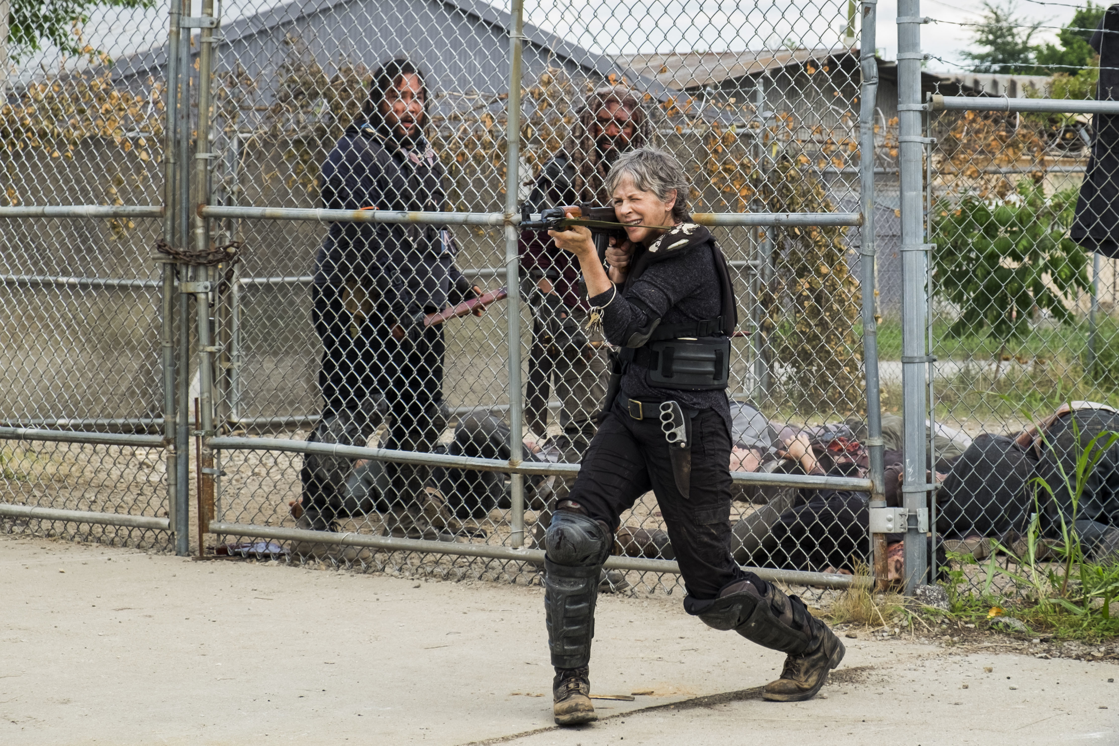 Carol from The Walking Dead aiming a crossbow HD Wallpaper