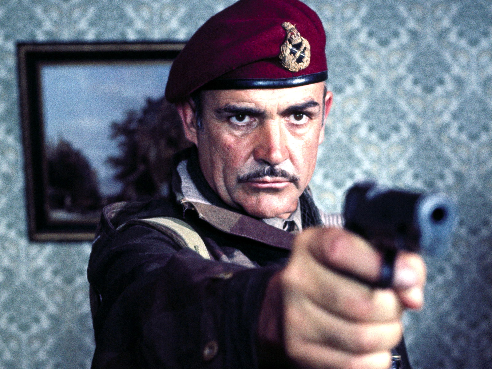 Sean Connery as a soldier holding a gun HD Wallpaper