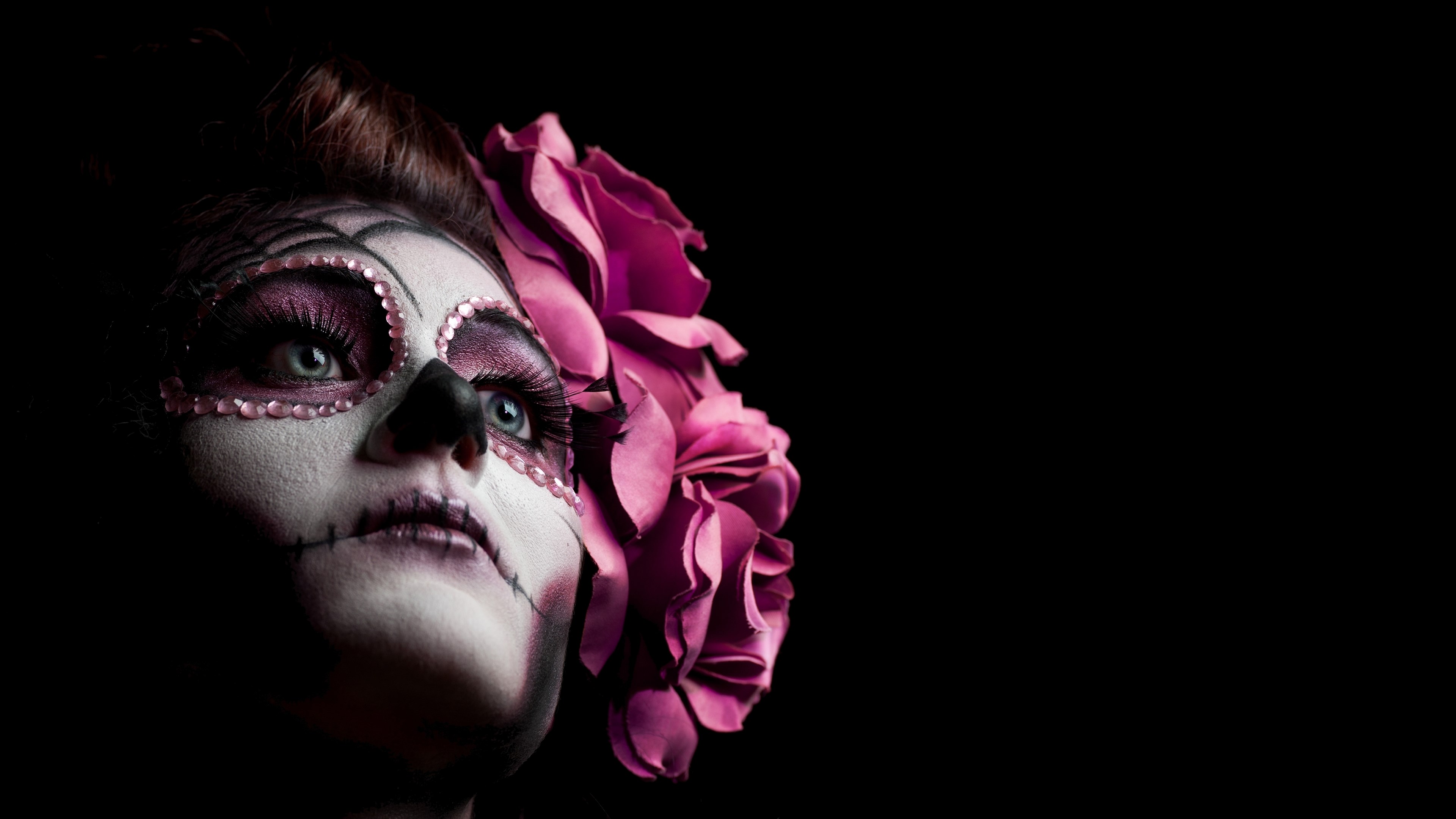 Woman with Day of the Dead makeup and pink roses HD Wallpaper