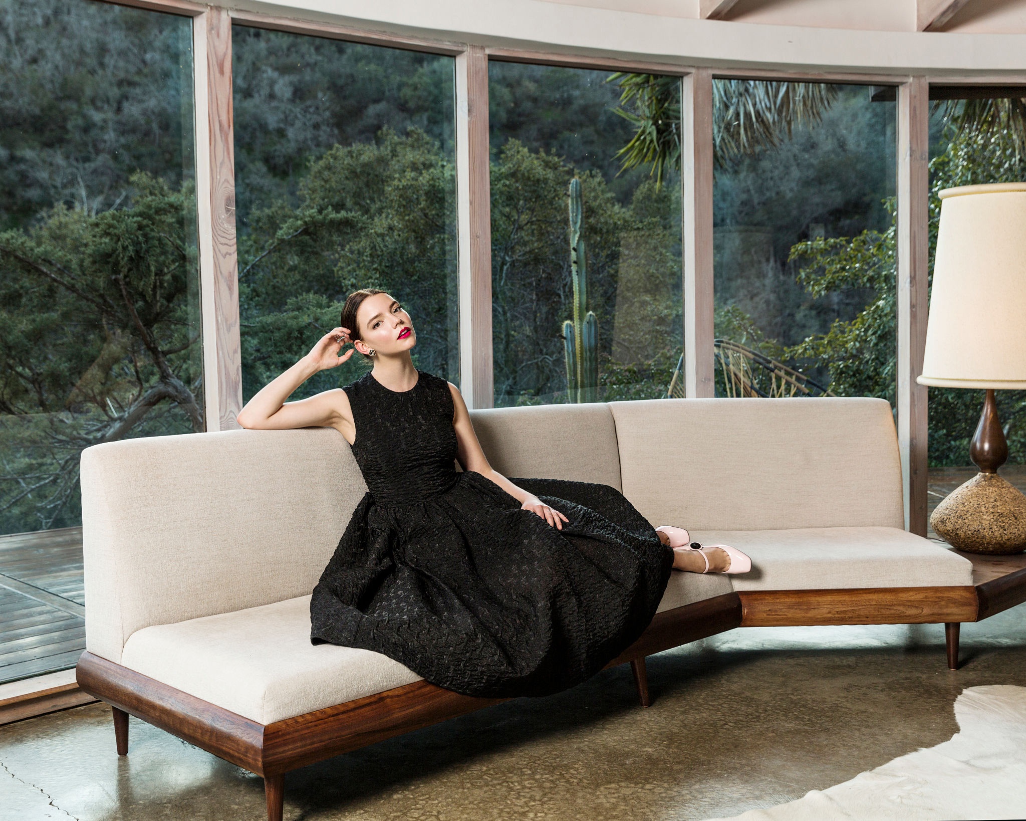 Anya Taylor-Joy on a couch HD Wallpaper