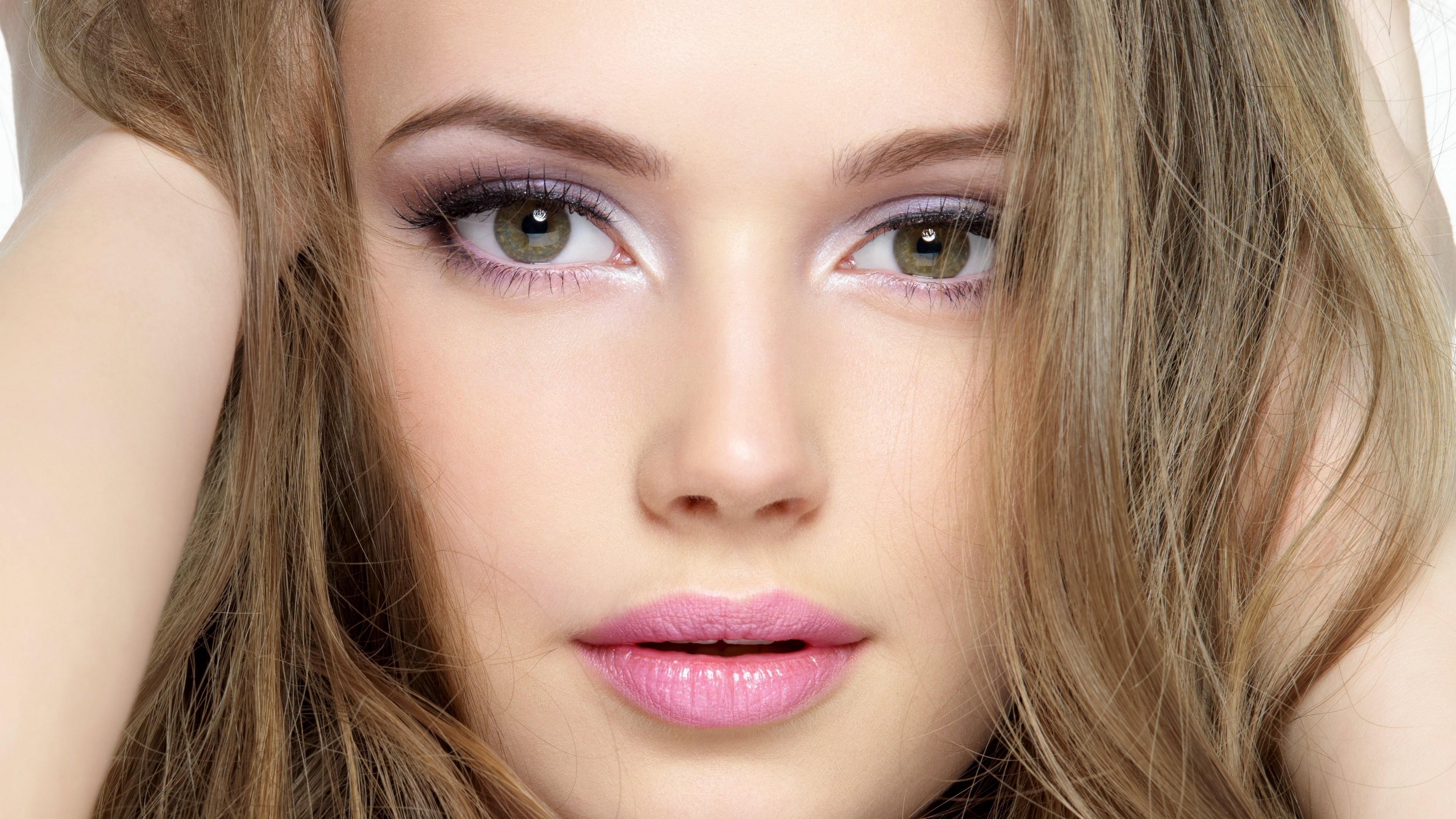 Close-up of a woman's face with makeup HD Wallpaper