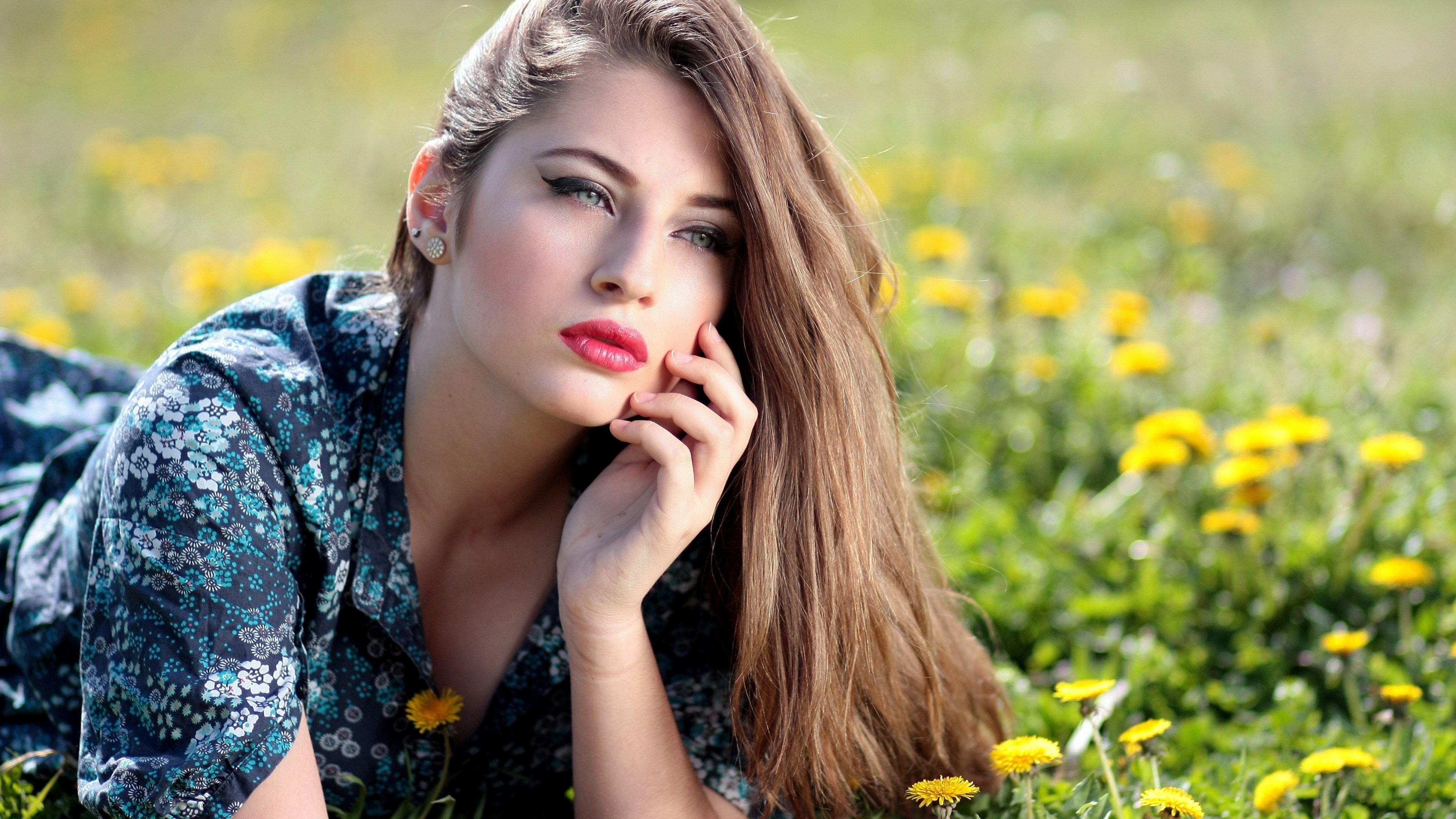 Woman lying in a field of dandelions HD Wallpaper