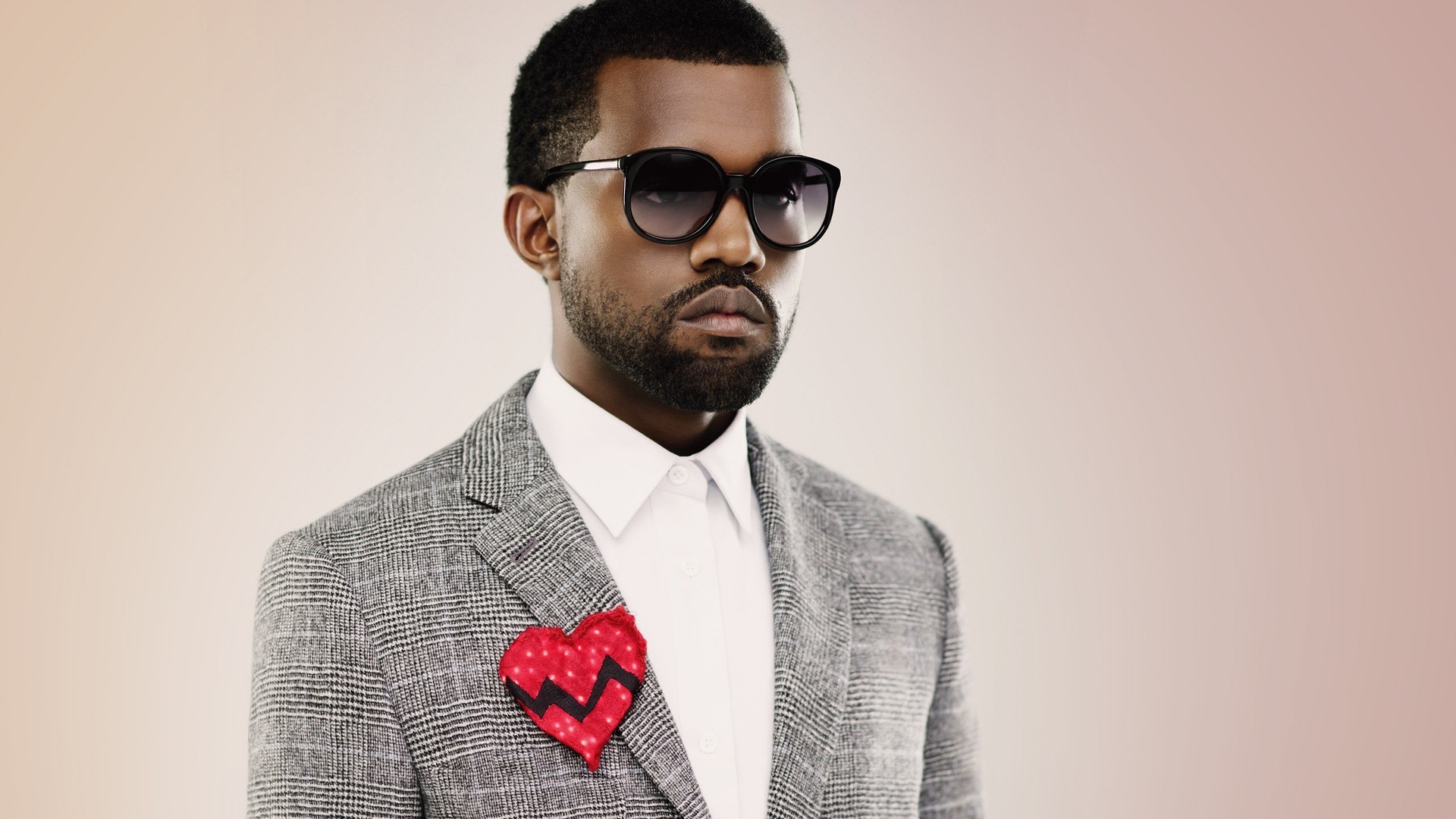 Kanye West wearing a suit and sunglasses HD Wallpaper
