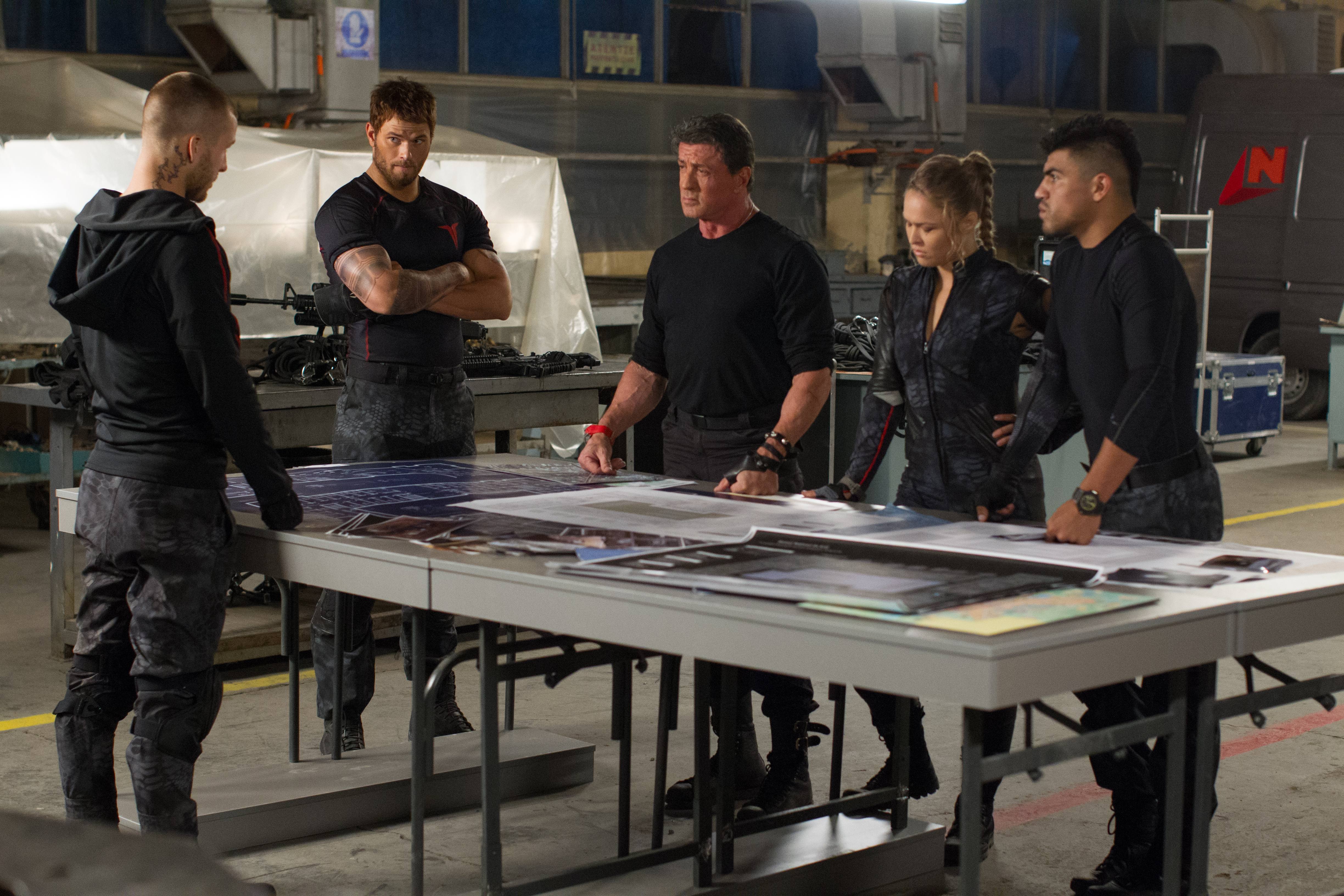 Sylvester Stallone and team in a hangar HD Wallpaper