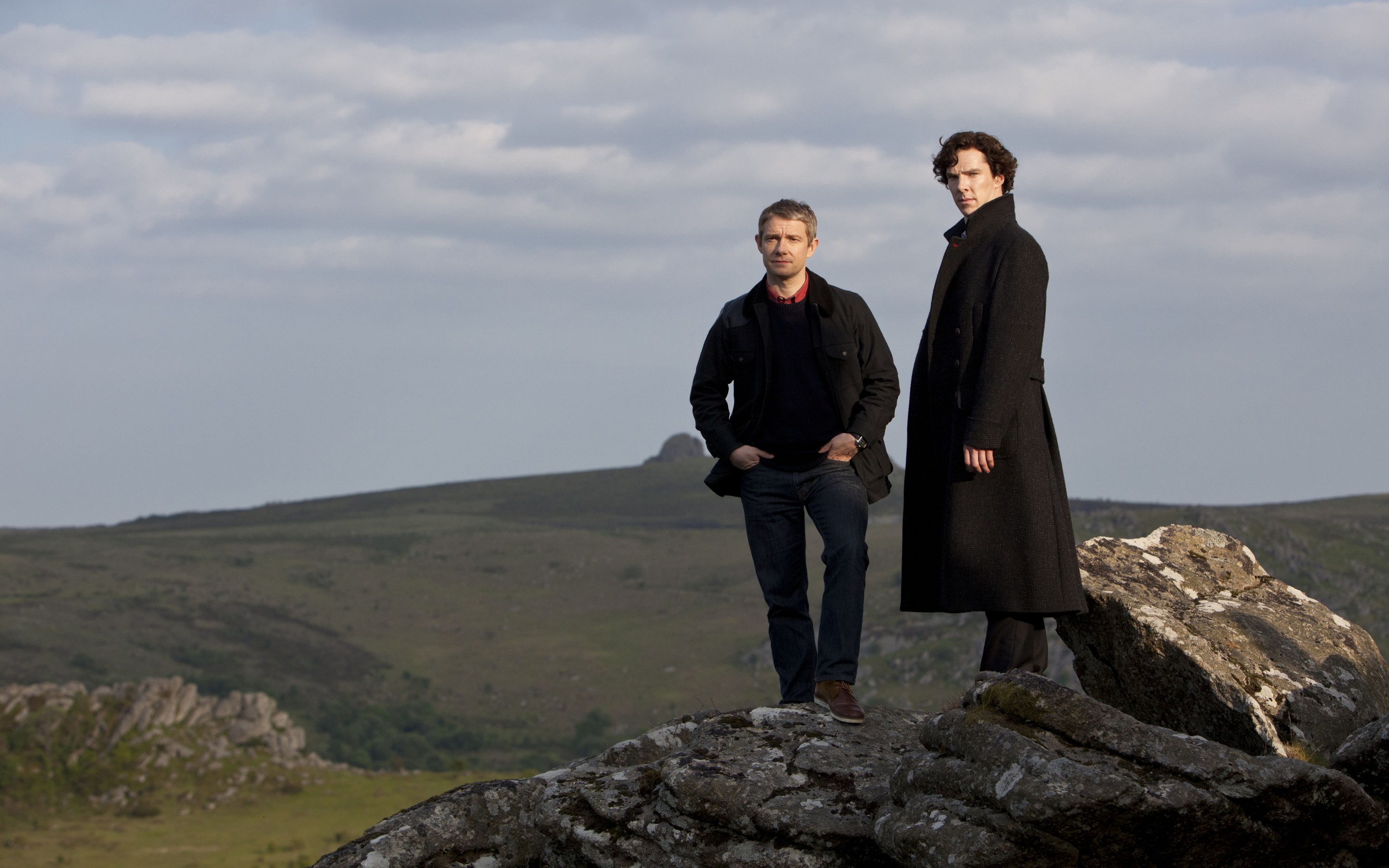 Martin Freeman and Benedict Cumberbatch on a rocky hill HD Wallpaper
