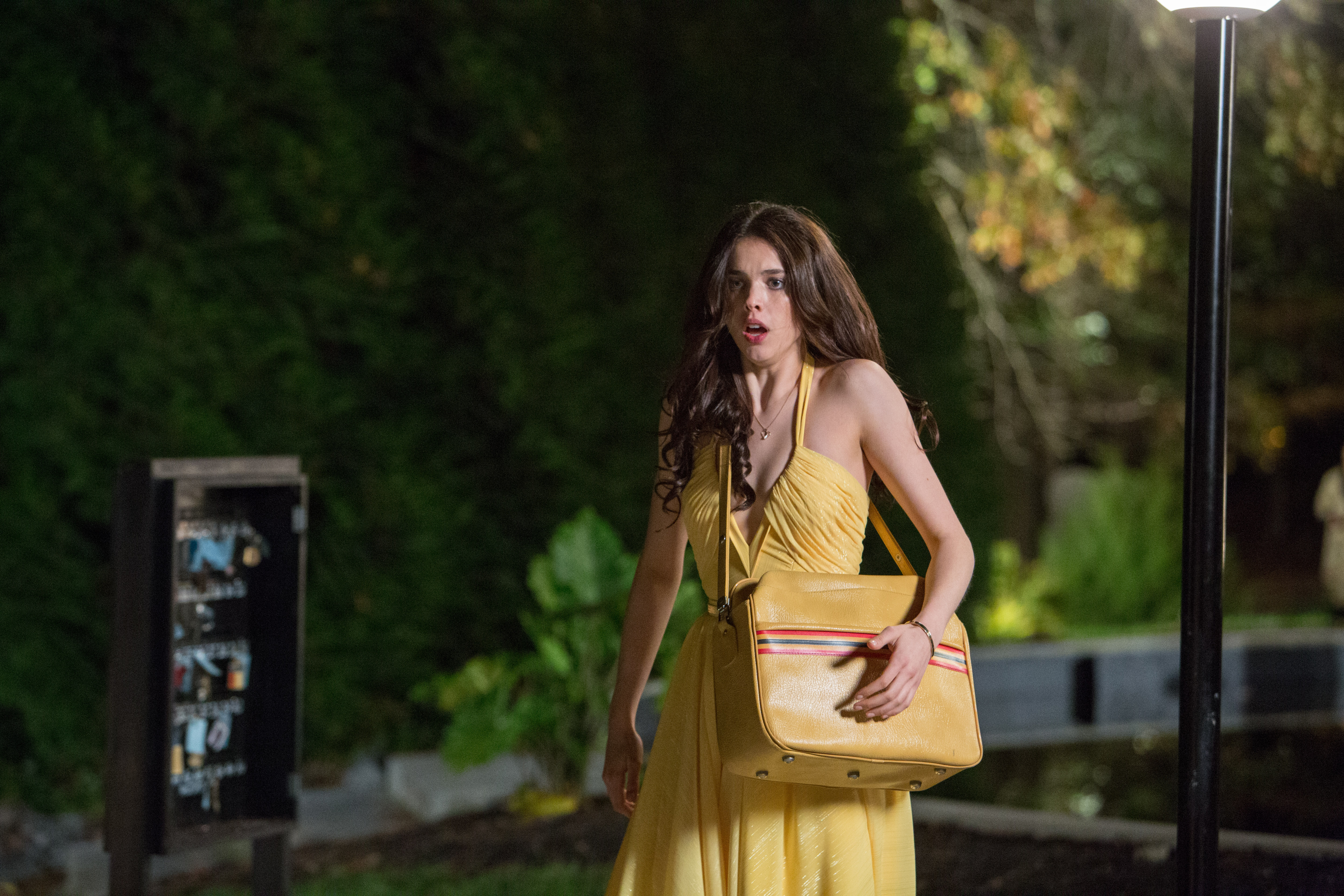 Margaret Qualley in yellow dress with purse HD Wallpaper