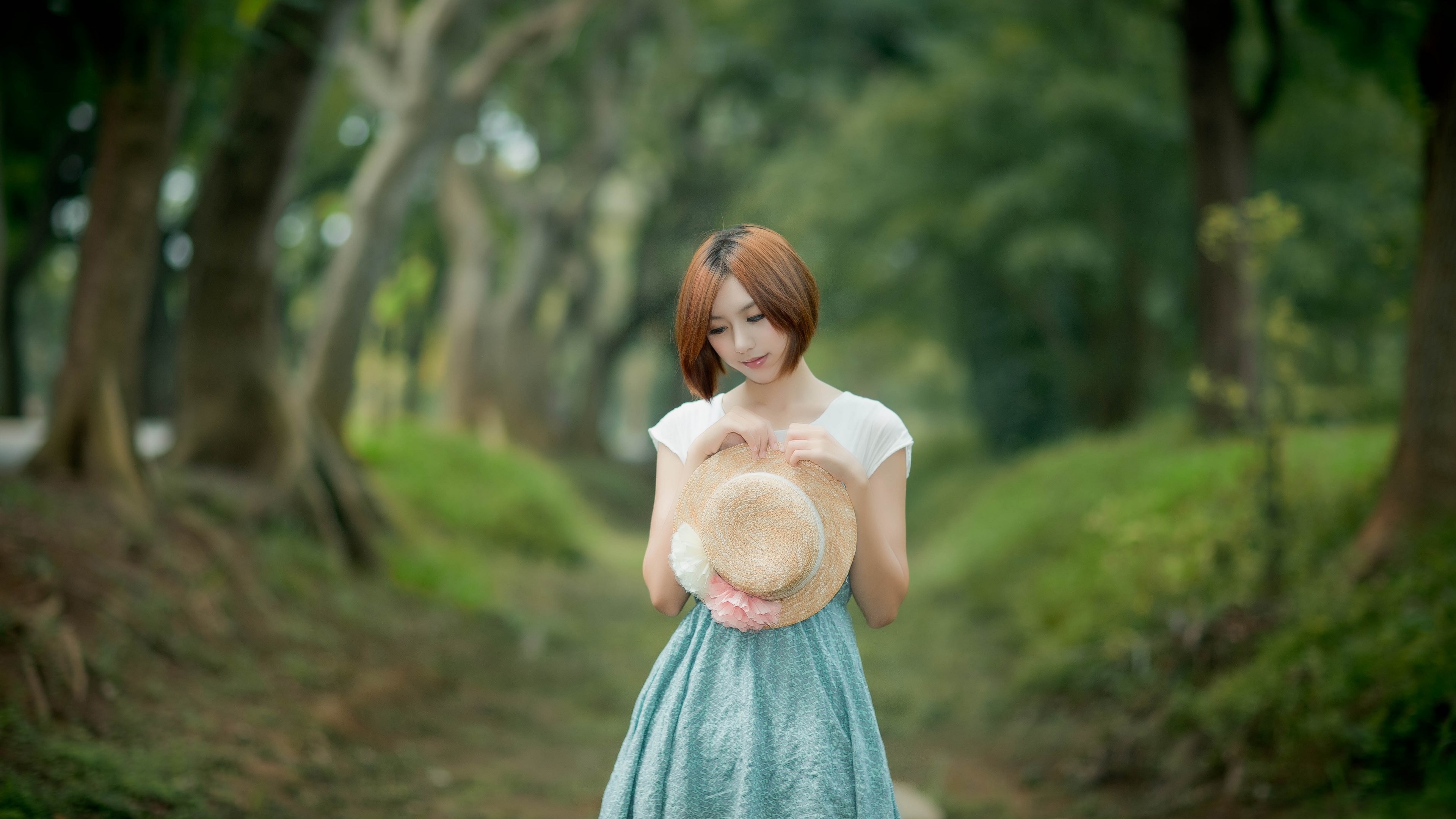 Woman in a straw hat and blue dress in a forest HD Wallpaper