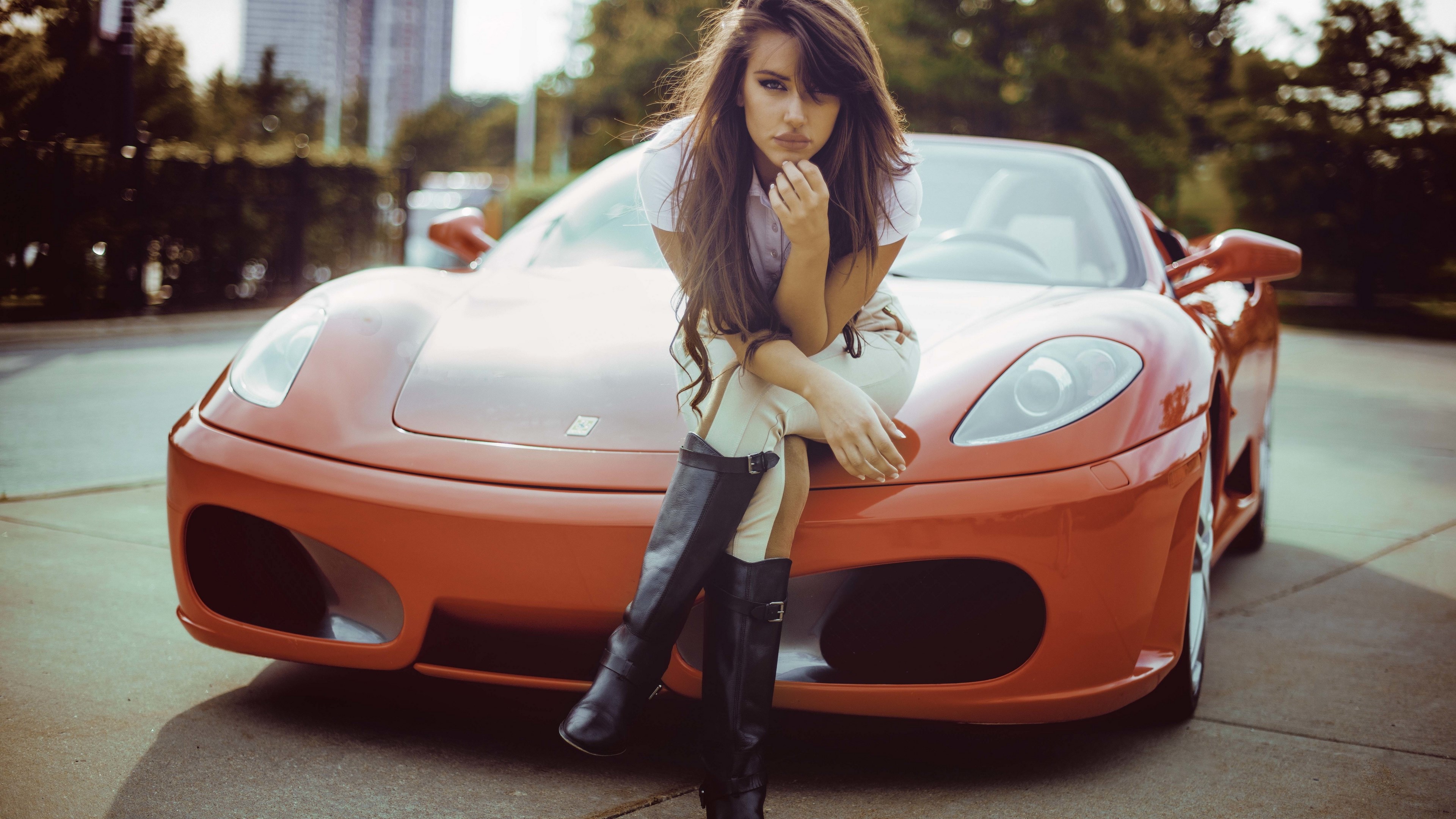 Woman sitting on a red Ferrari HD Wallpaper