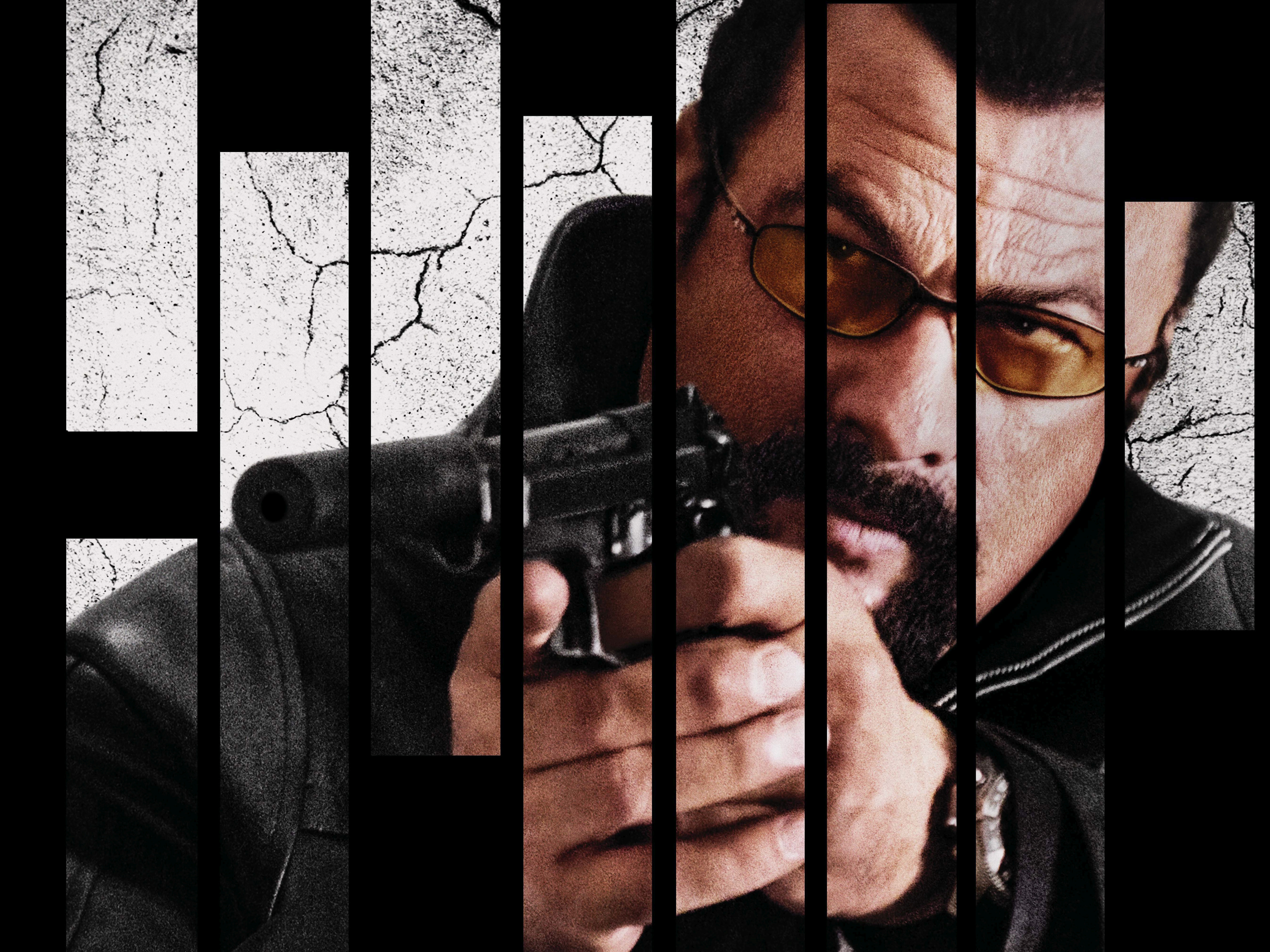 Steven Seagal holding a gun HD Wallpaper