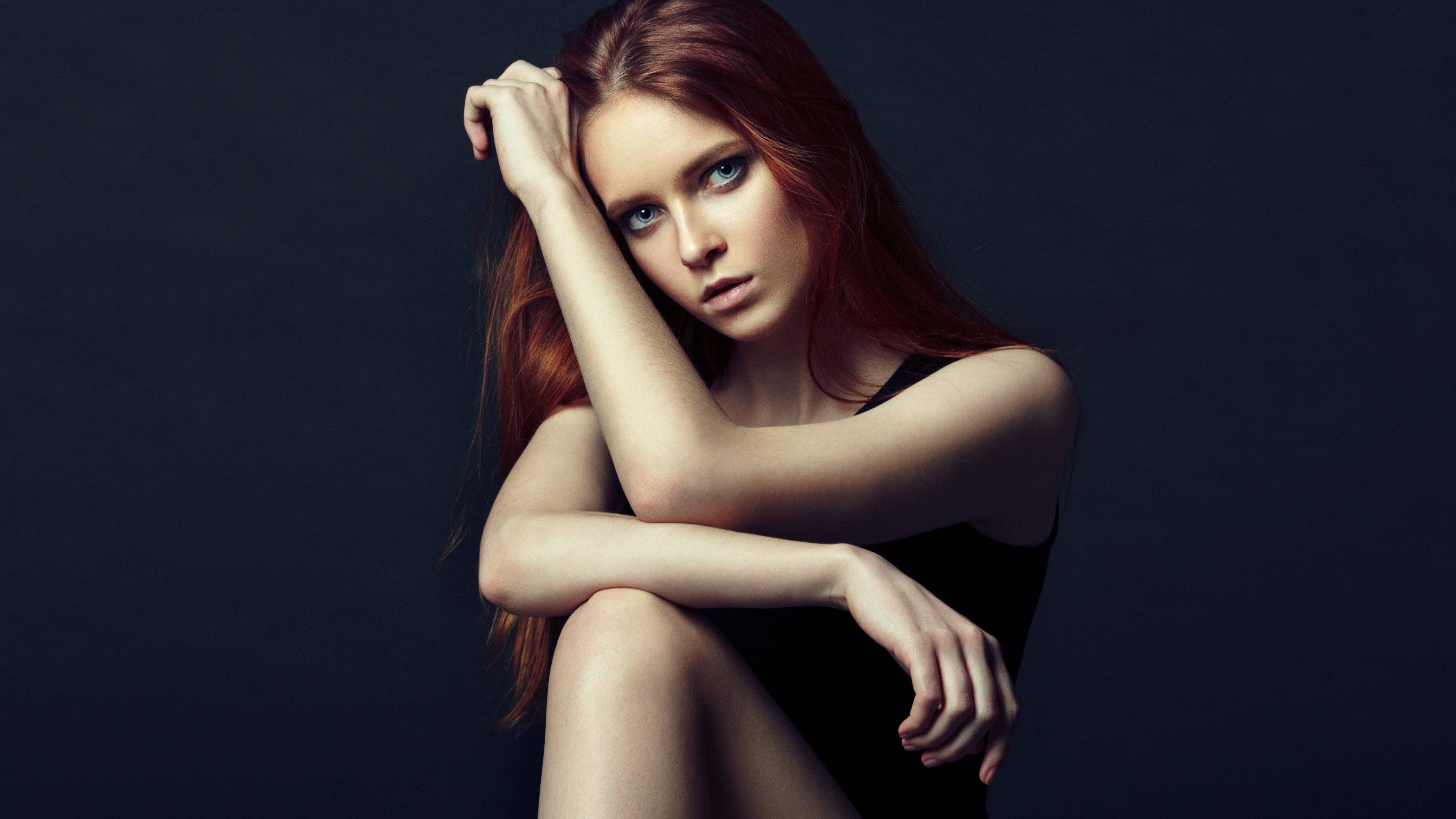 Red-haired woman with blue eyes posing HD Wallpaper