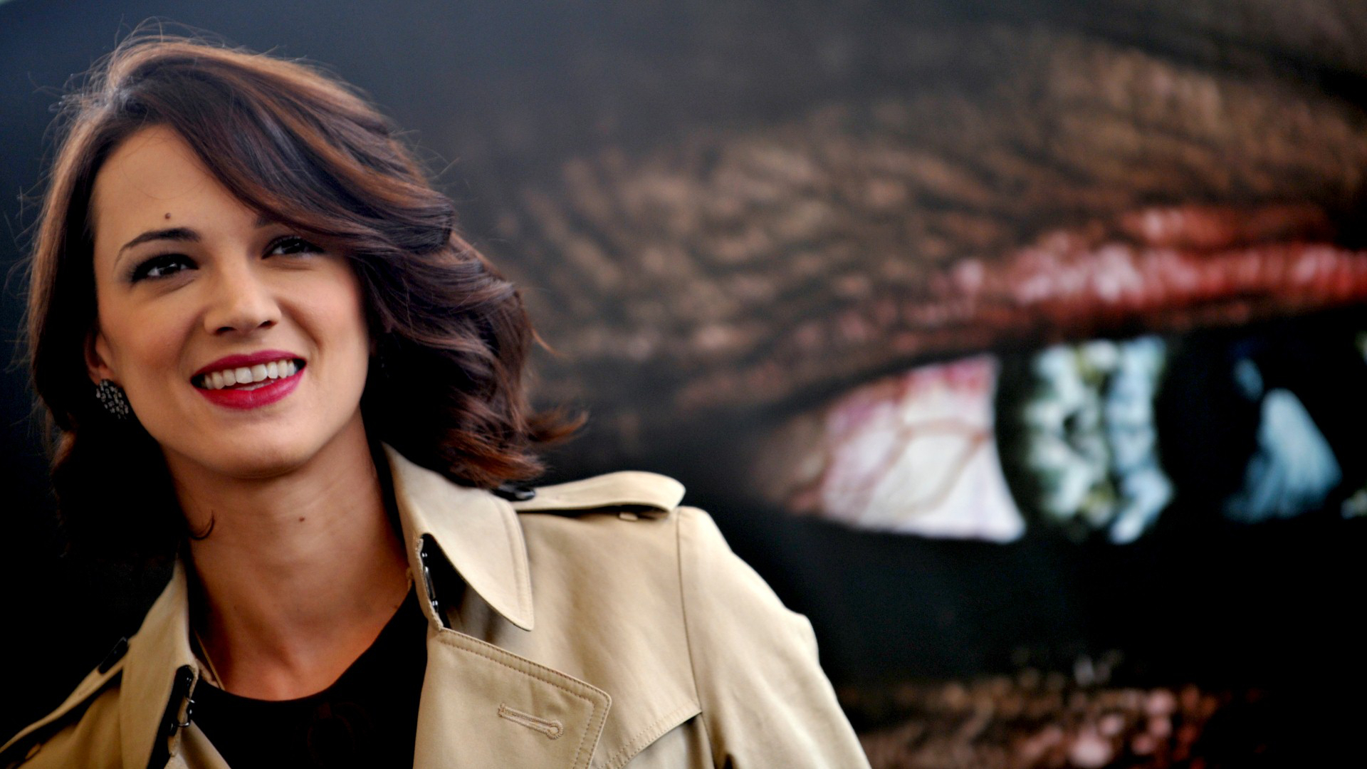Asia Argento in a beige trench coat HD Wallpaper
