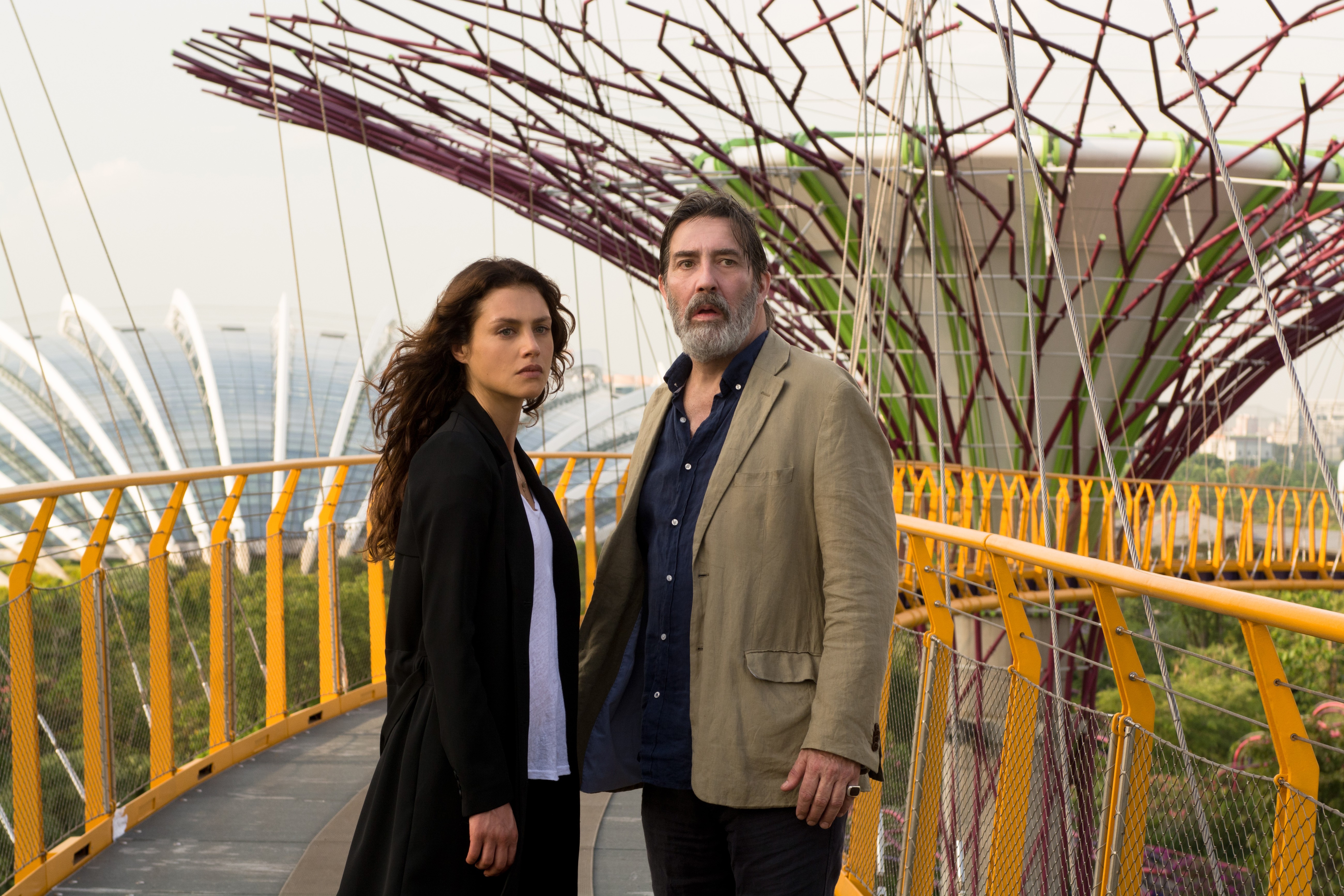 Ciarán Hinds and woman on bridge HD Wallpaper
