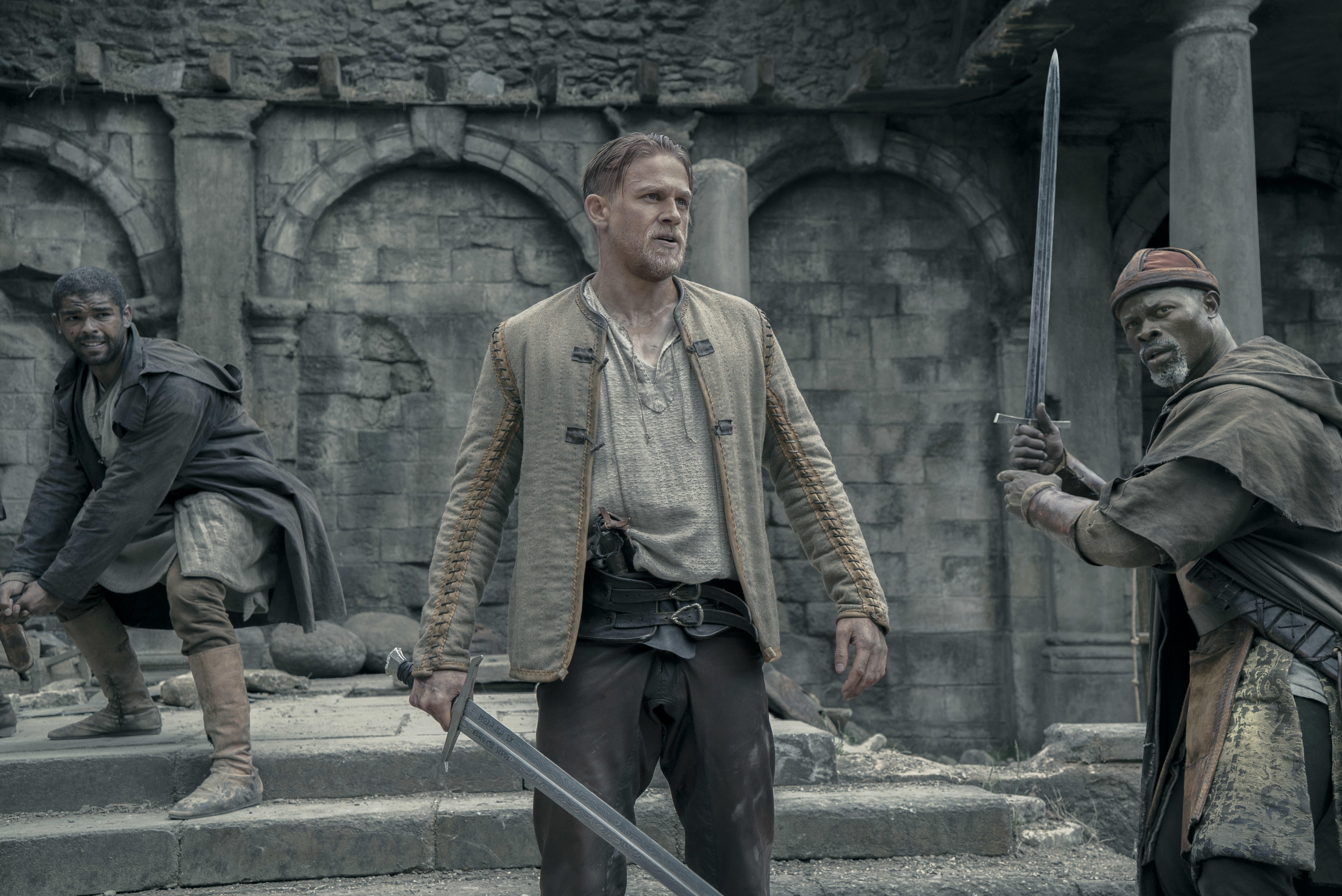 Djimon Hounsou and two men with swords HD Wallpaper