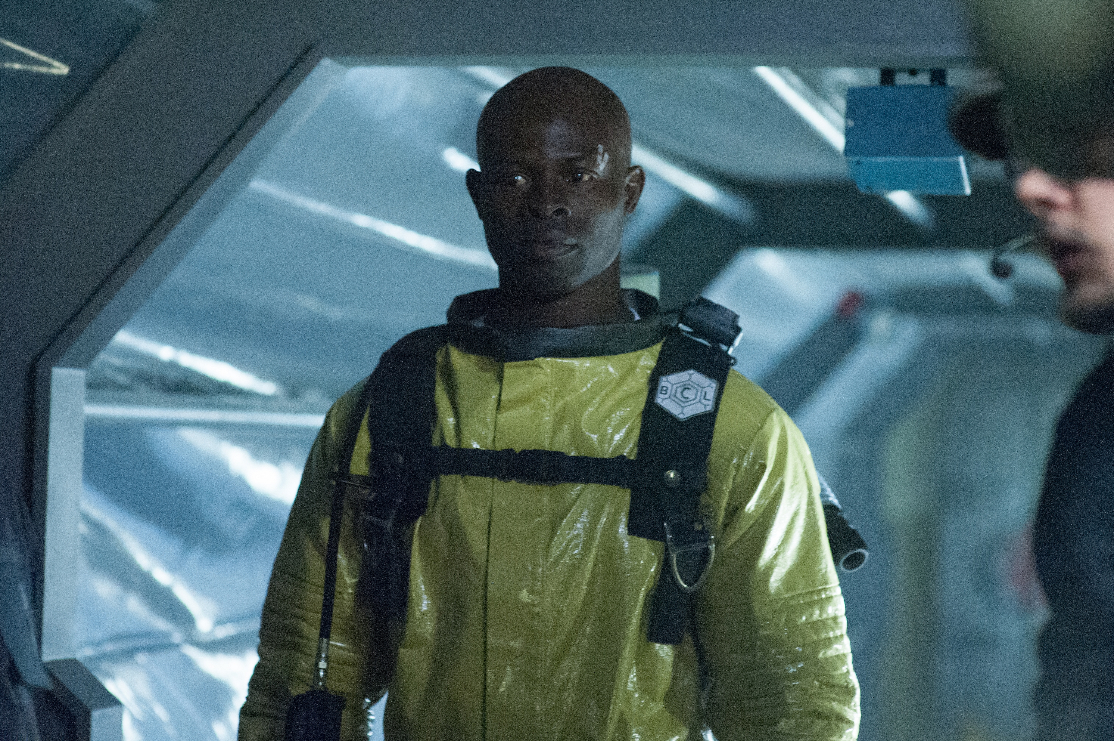 Djimon Hounsou in a yellow hazmat suit HD Wallpaper
