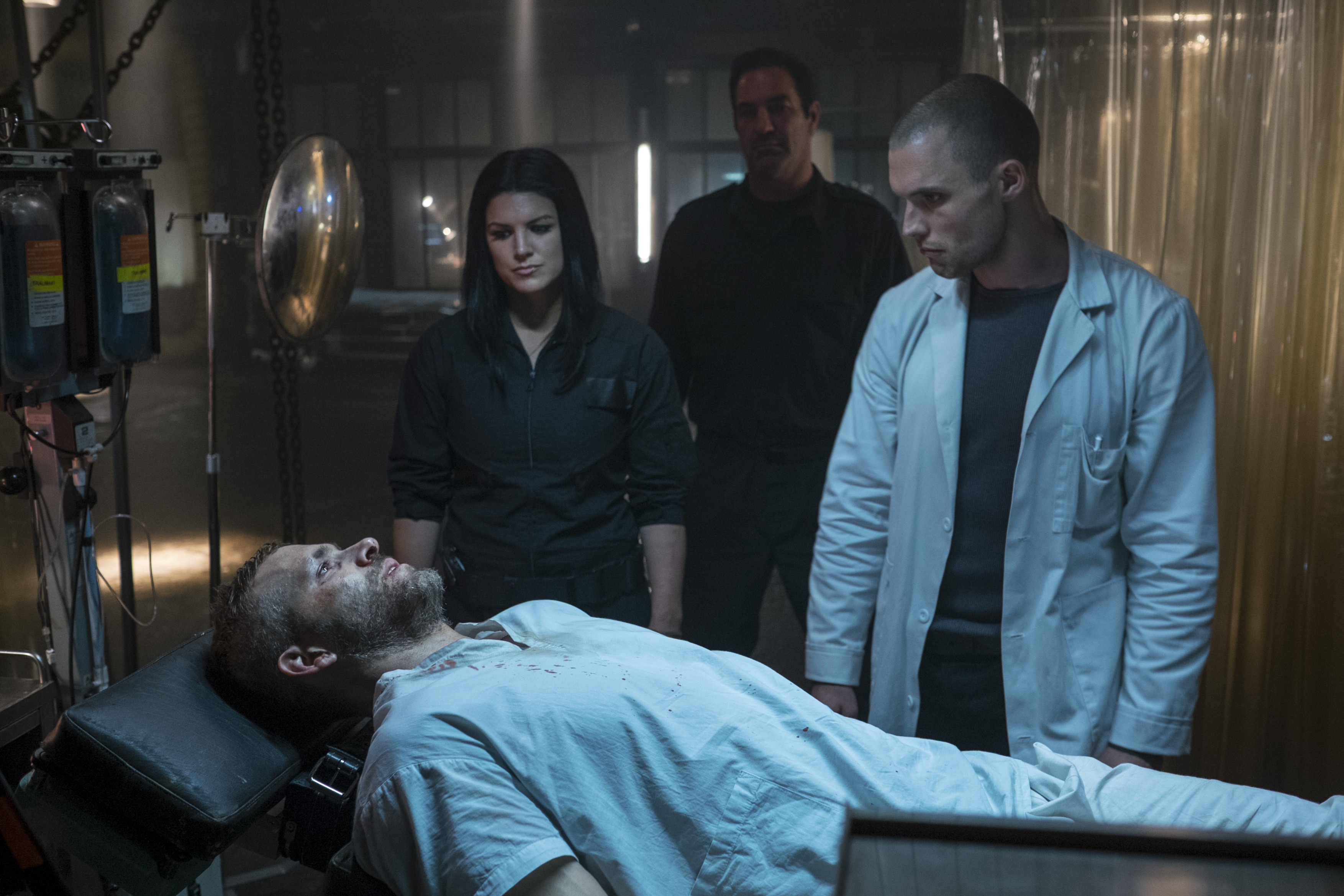 Gina Carano and men in a medical setting HD Wallpaper