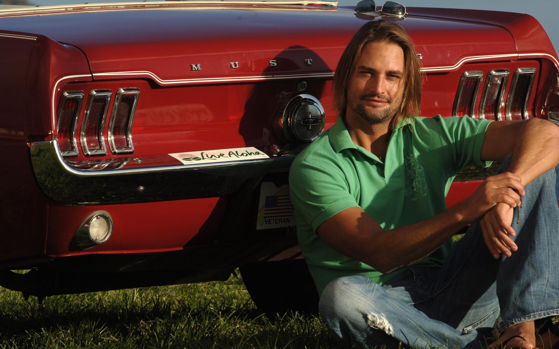 Josh Holloway sitting by a red Ford Mustang HD Wallpaper
