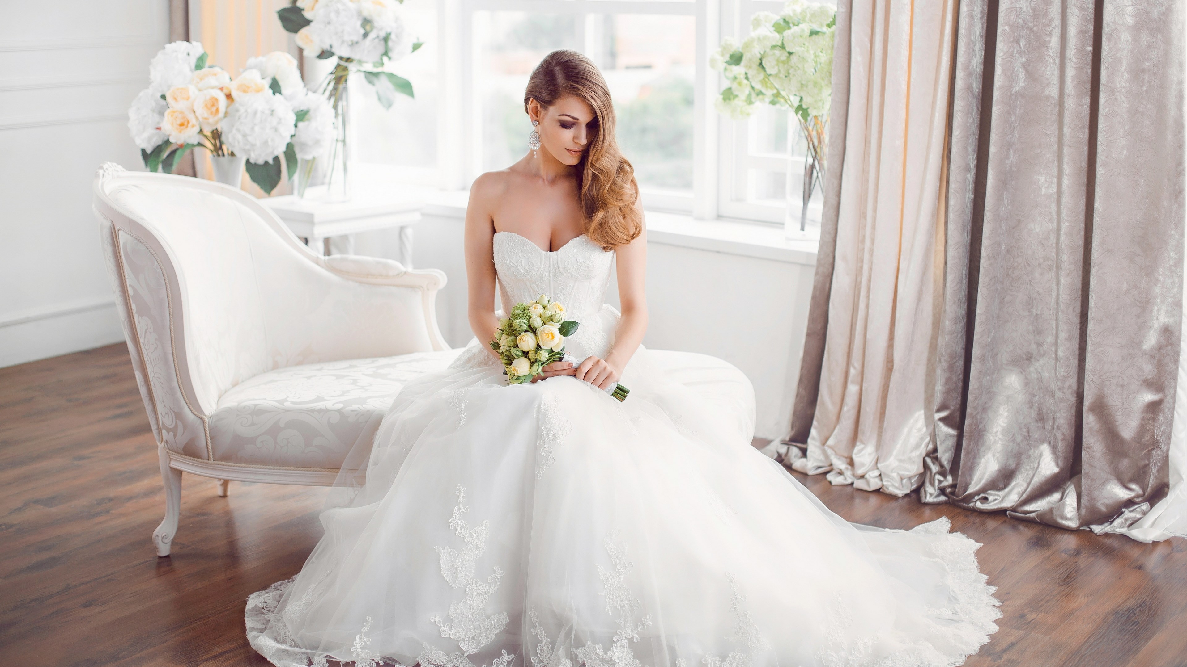 Bride in a white dress holding a bouquet HD Wallpaper