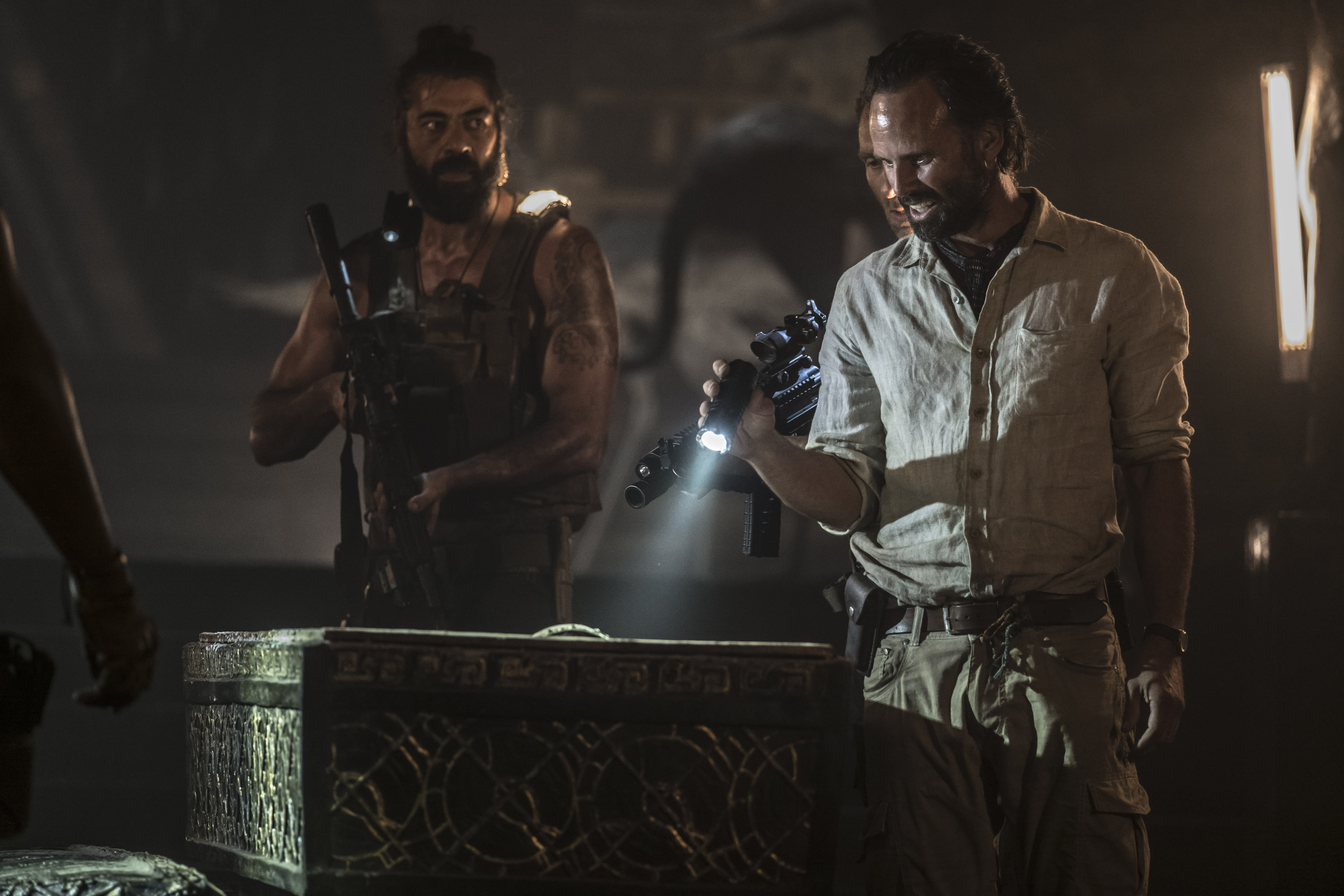 Walton Goggins and man with guns in dark room HD Wallpaper