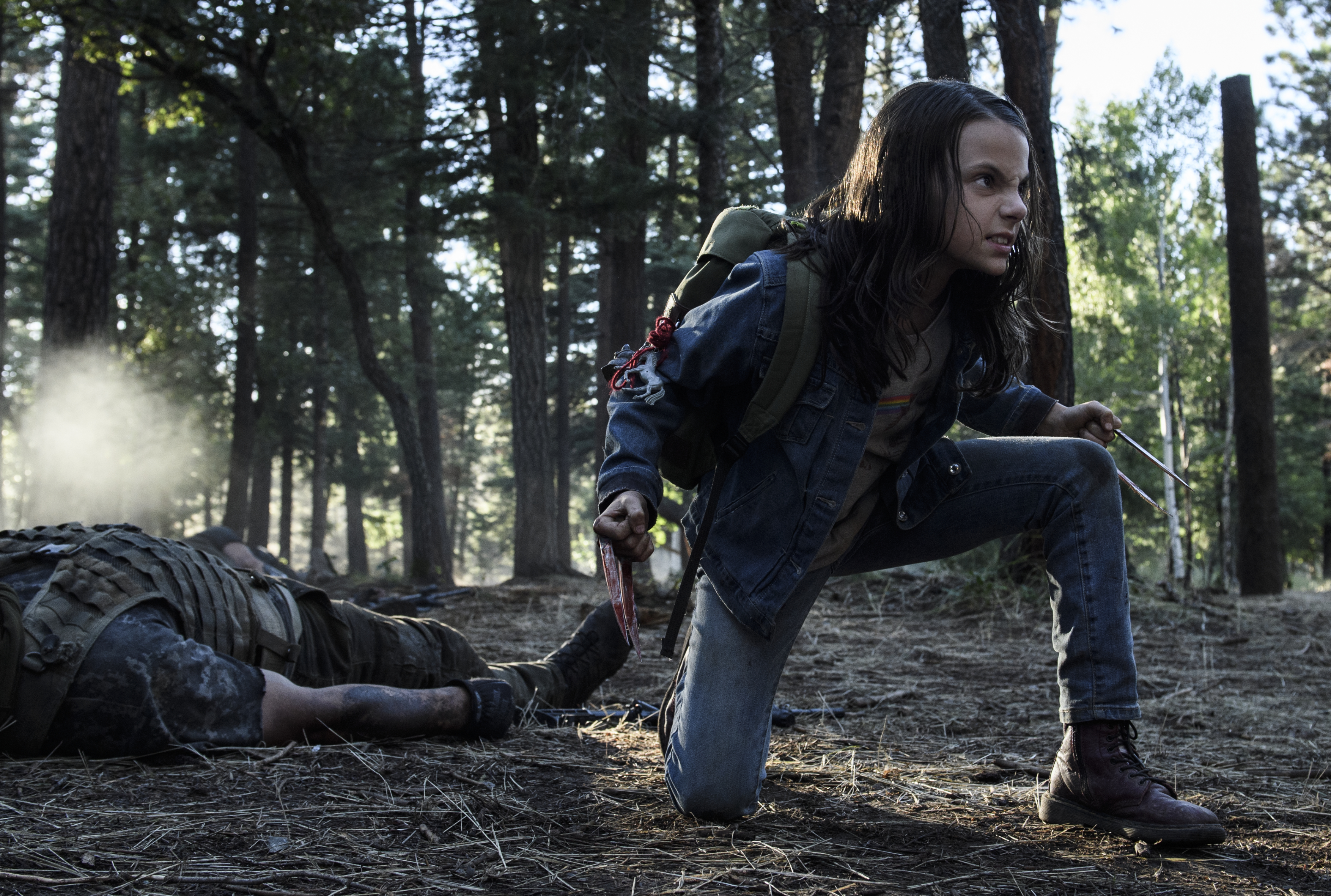 Laura Kinney (X-23) from Logan in a forest HD Wallpaper