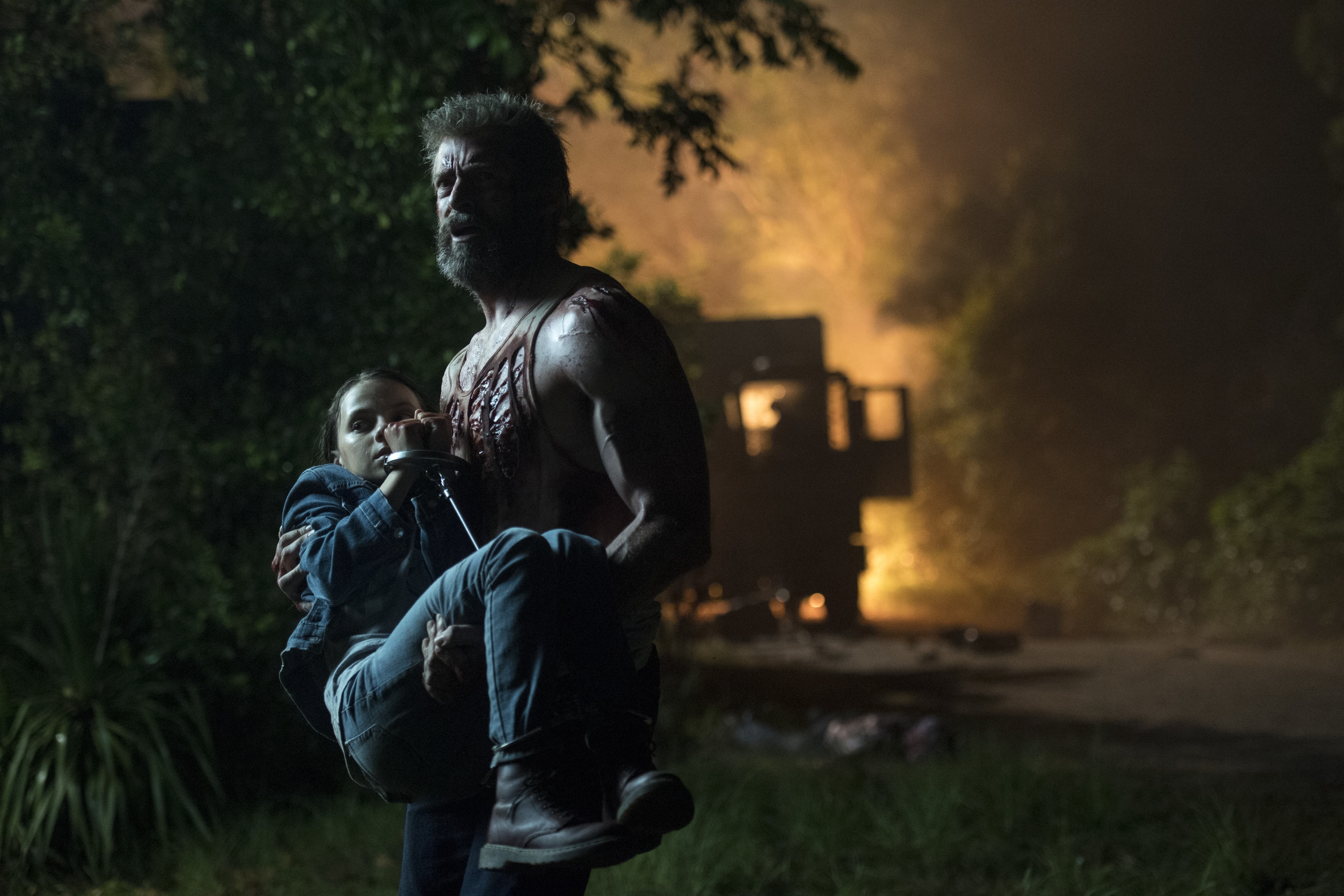 Logan carrying Dafne Keen HD Wallpaper